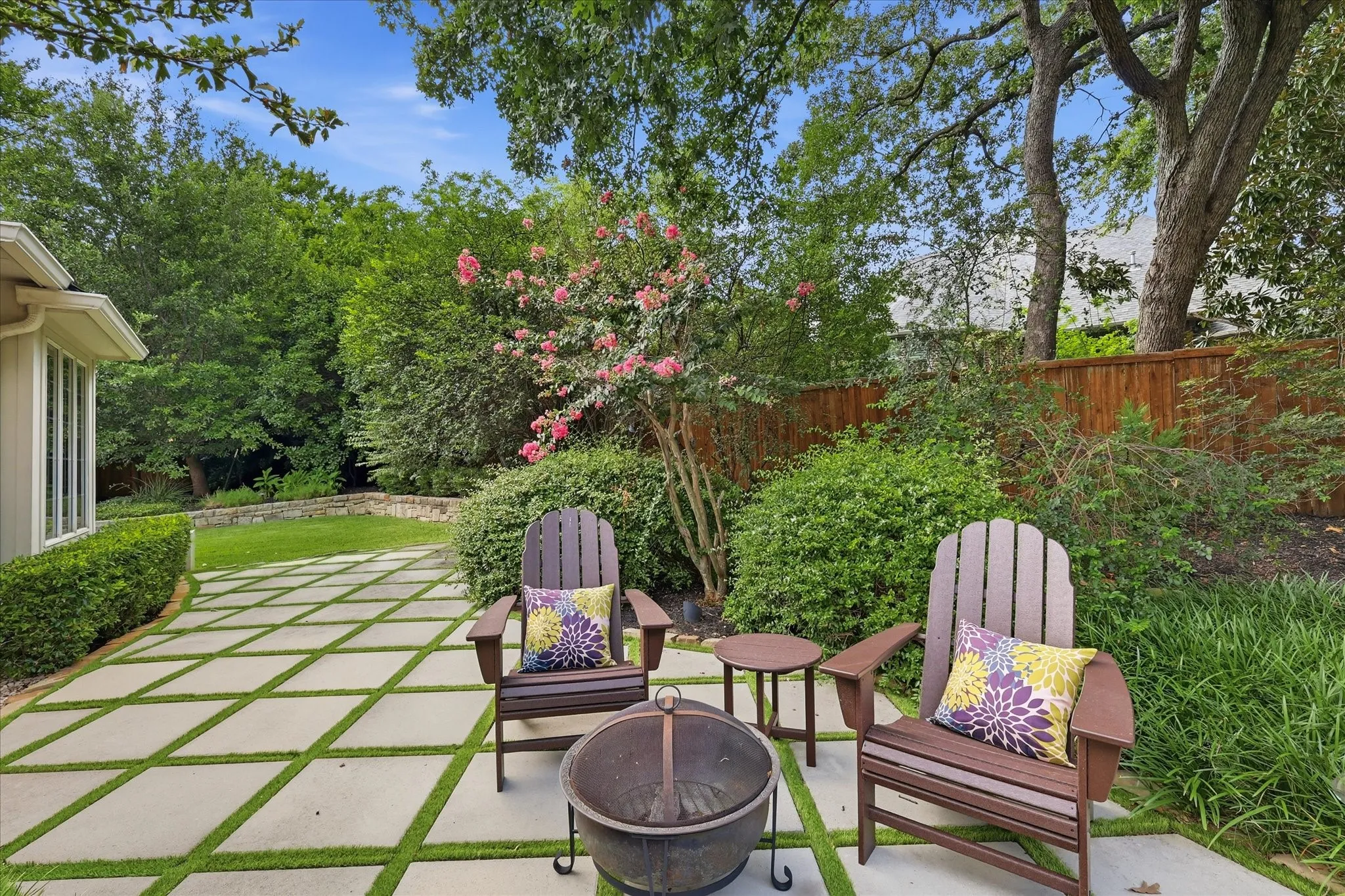 Lots more yard to the left with lush landscape & privacy.