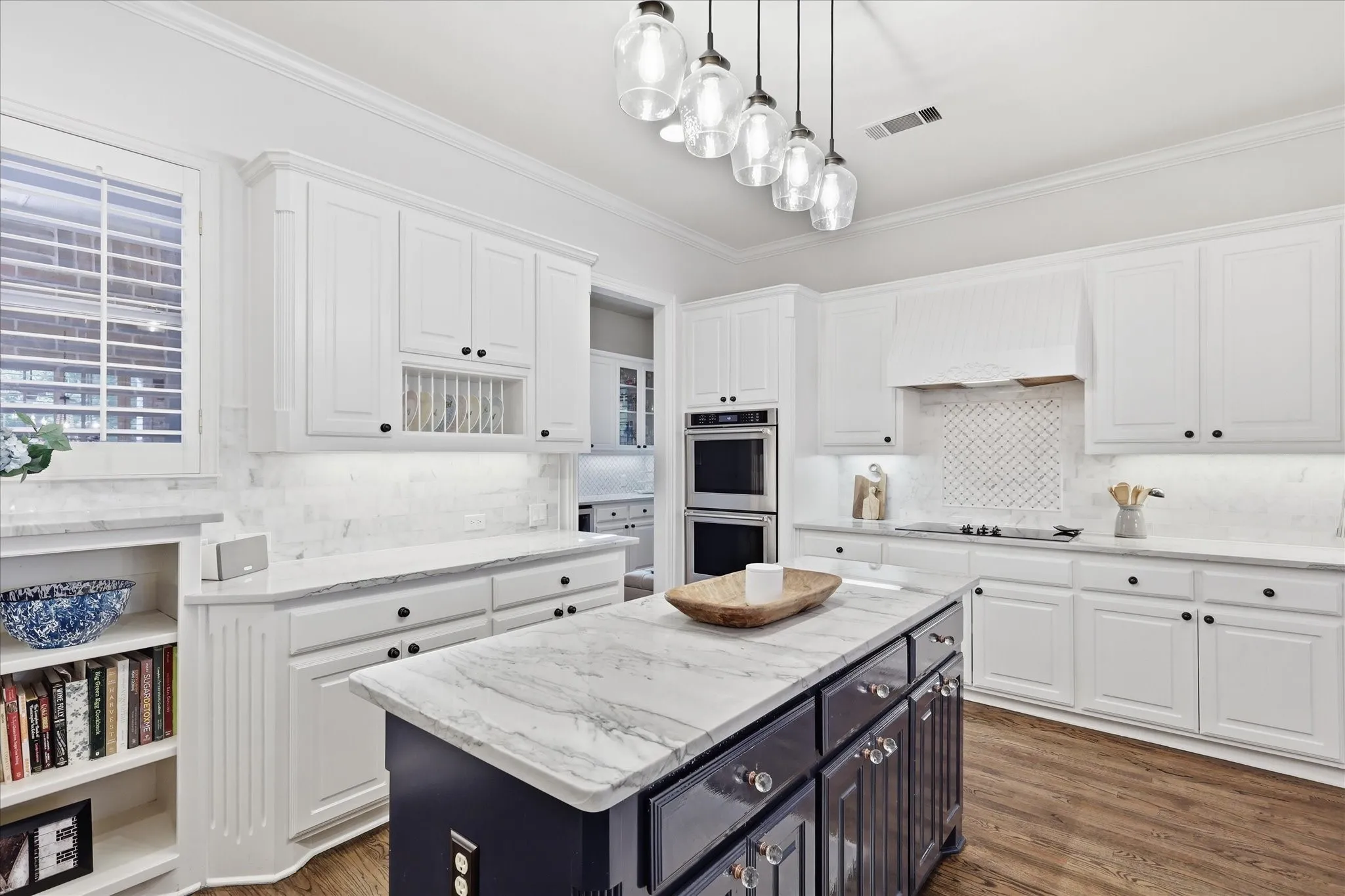 Open to the liv & brk areas is this gourmet kitchen with Quartzite tops & built-in Frig-Freezer.