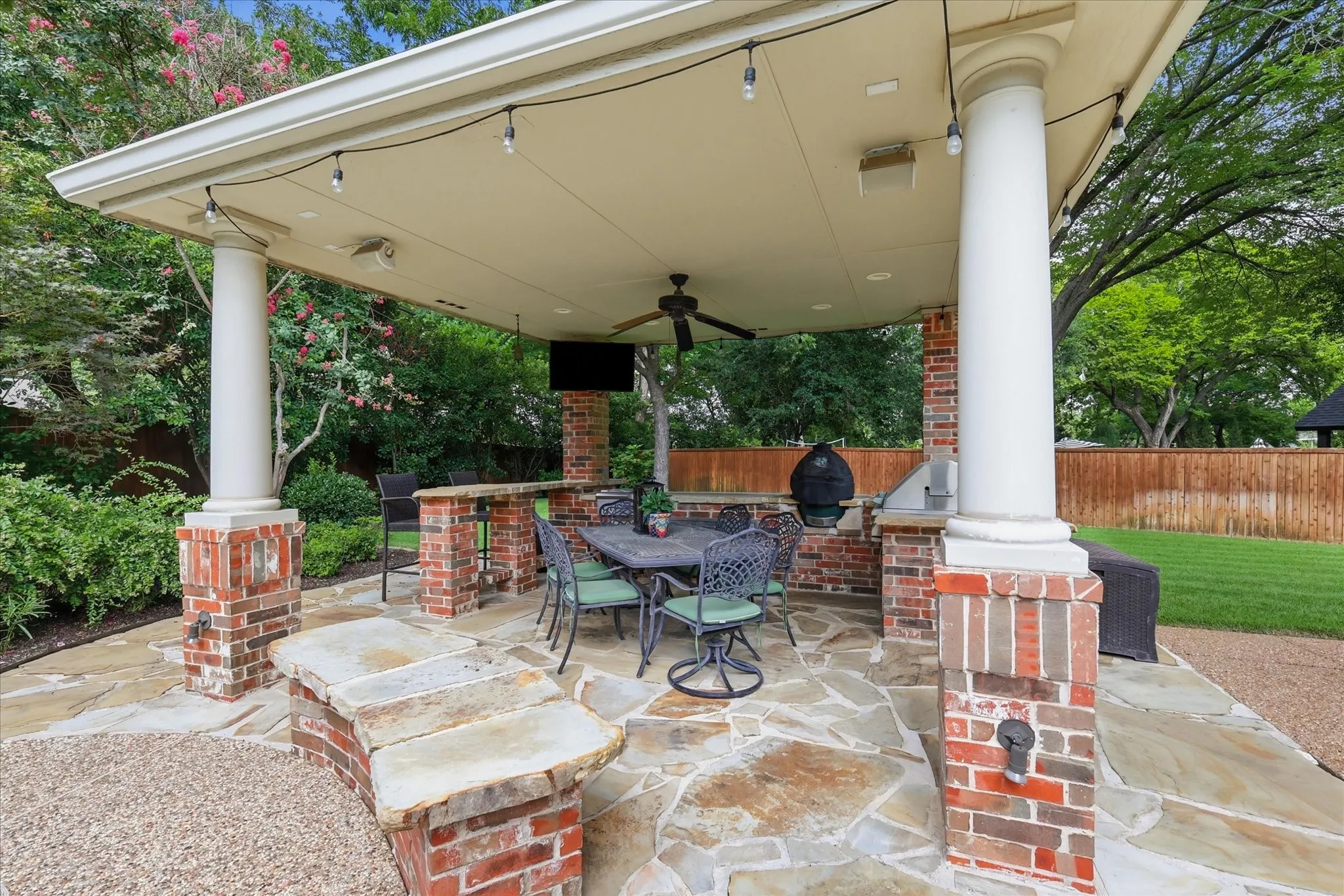 Outdoor living & kitchen area with grill.