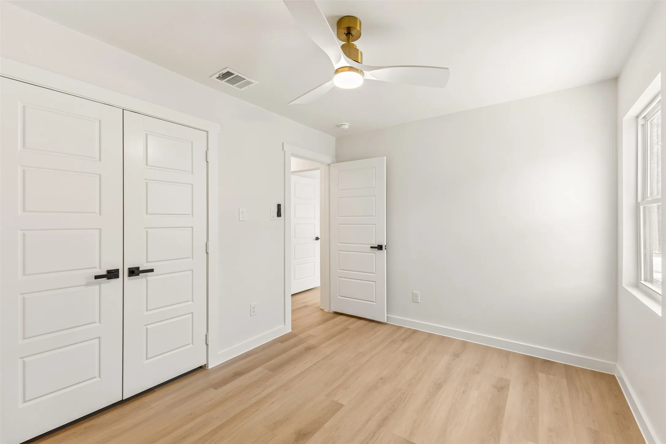 Bright interior space featuring light wood-finish flooring