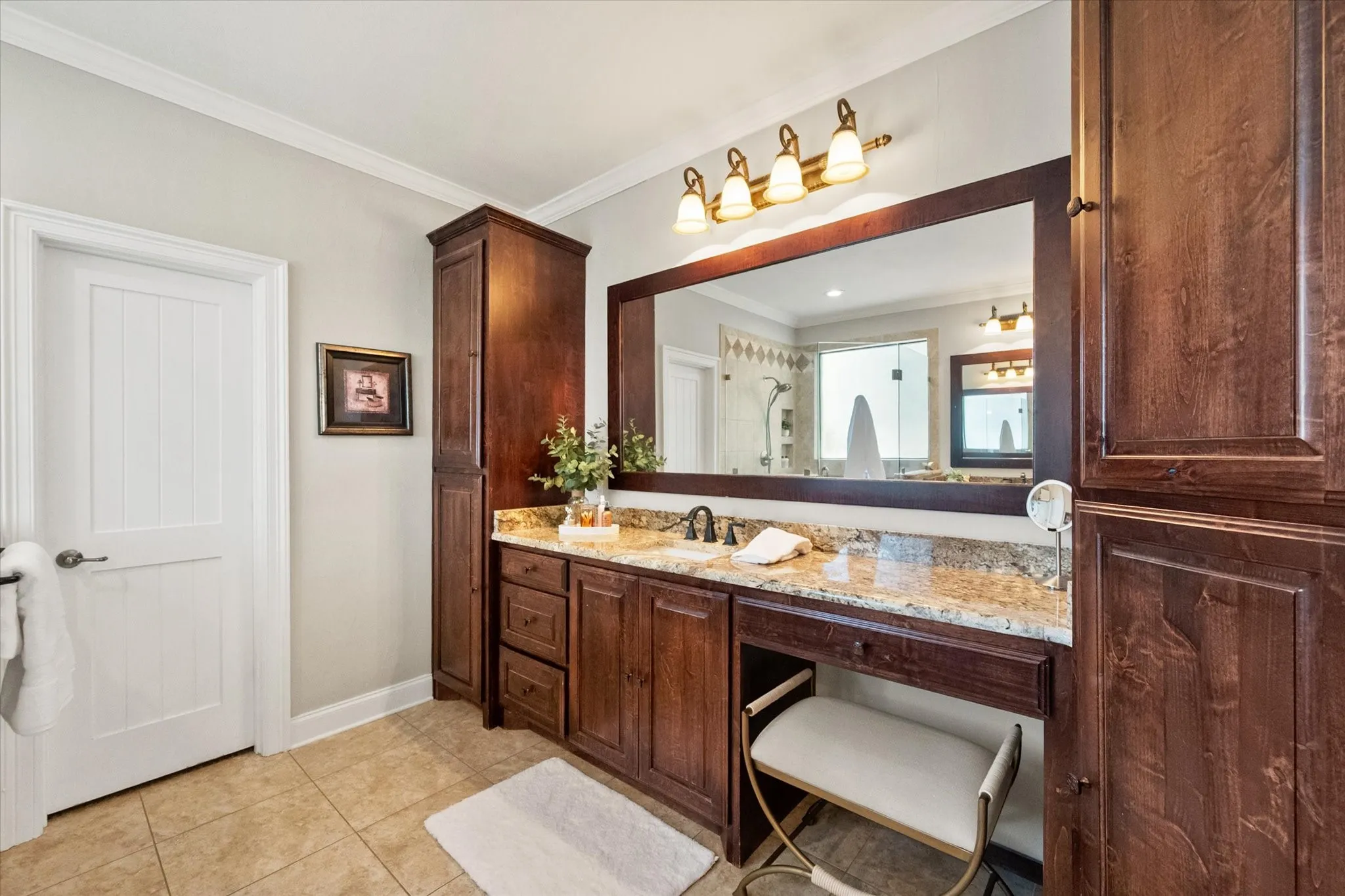 The primary bathroom has dual vanities and plenty of cabinet space