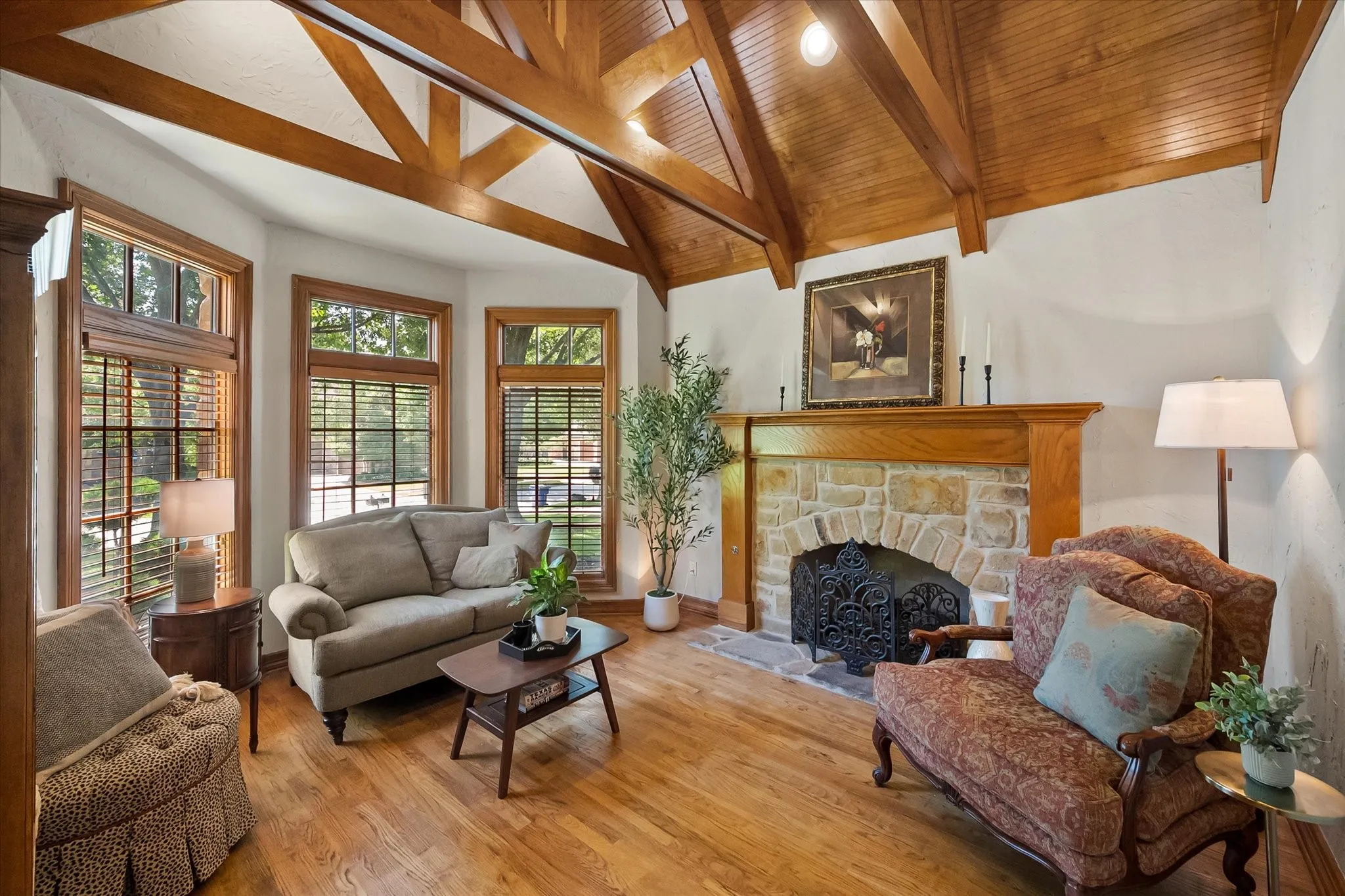 Living room or office with wood flooring, fireplace and beautiful ceiling detailing