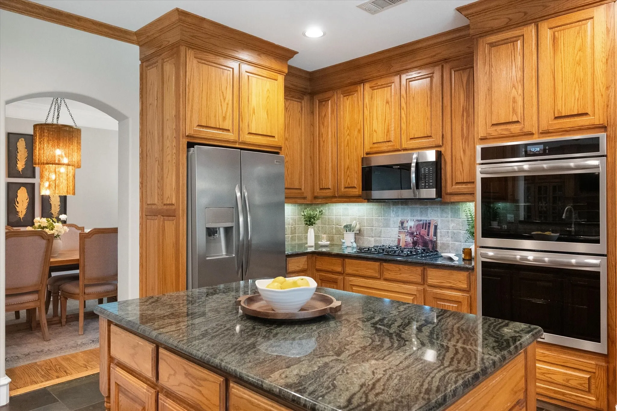 Granite countertops, lots of cabinet space, and a large island