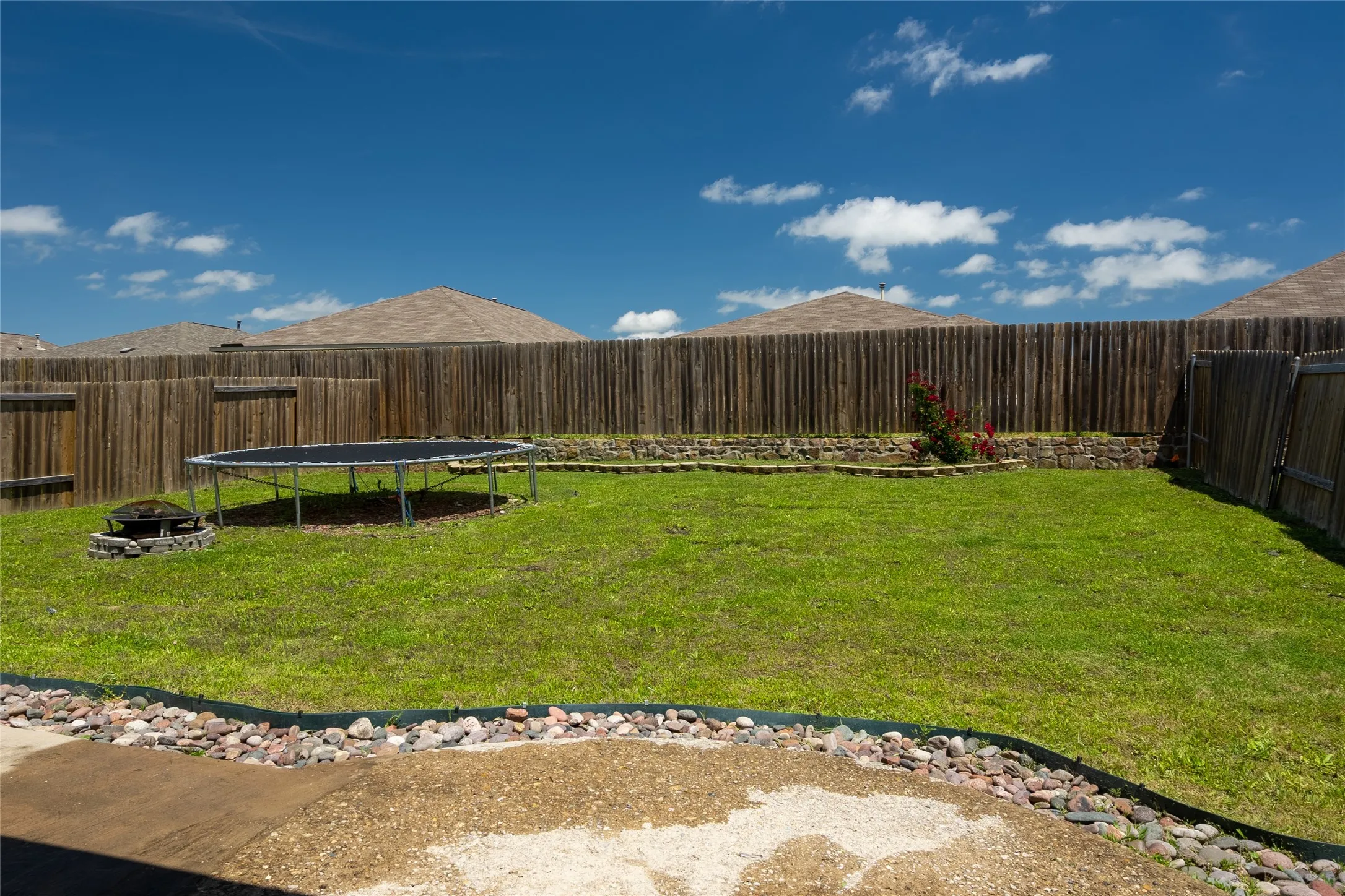 View of yard featuring a trampoline