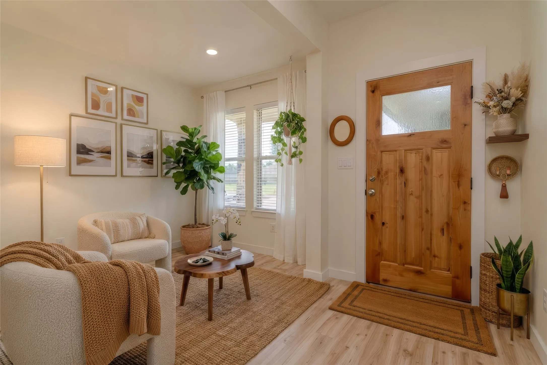 Entryway featuring a wood-panel door with privacy glass, recessed lighting, and wood-finish flooring