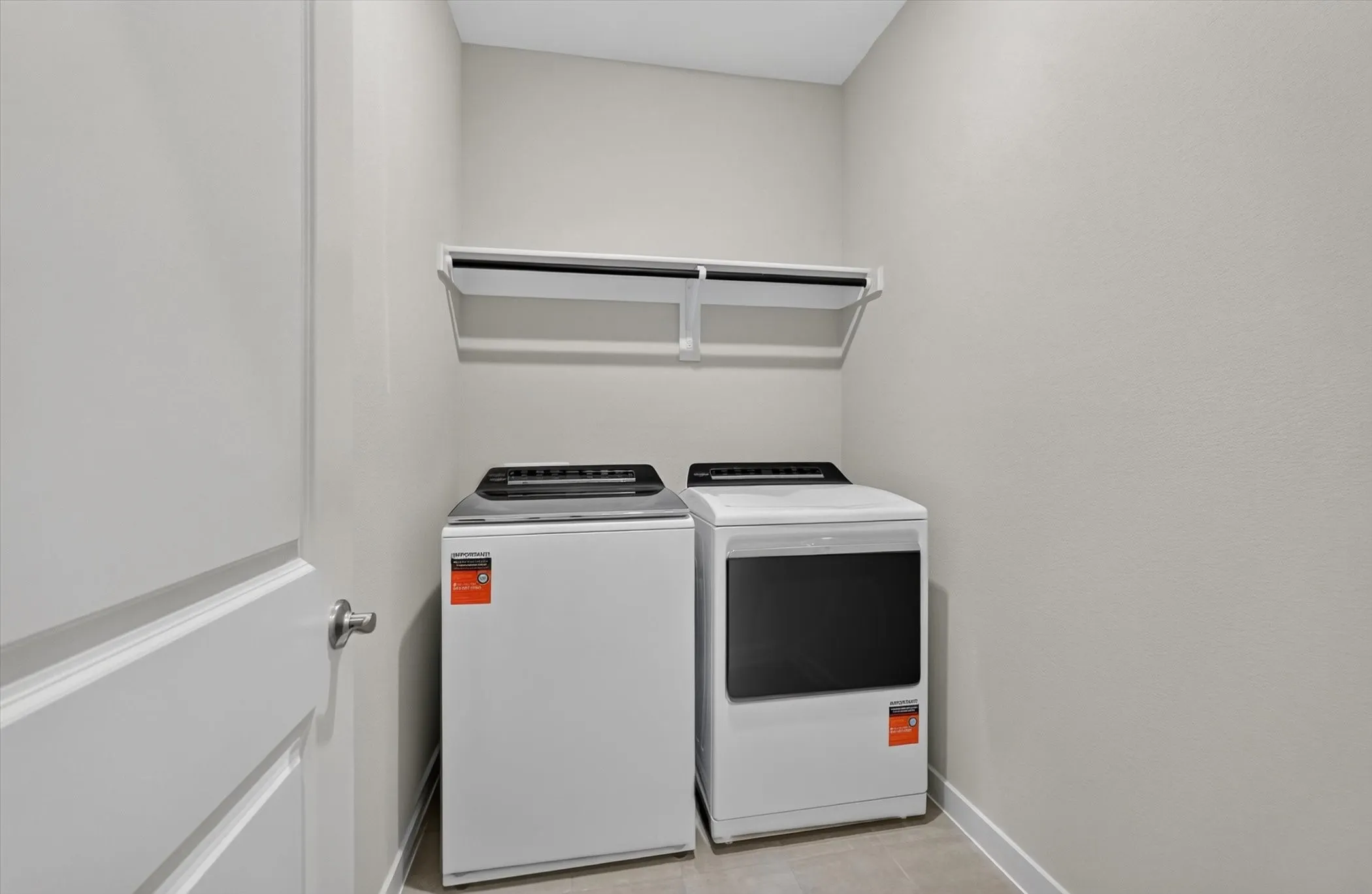 Dedicated utility area with neutral wall tones