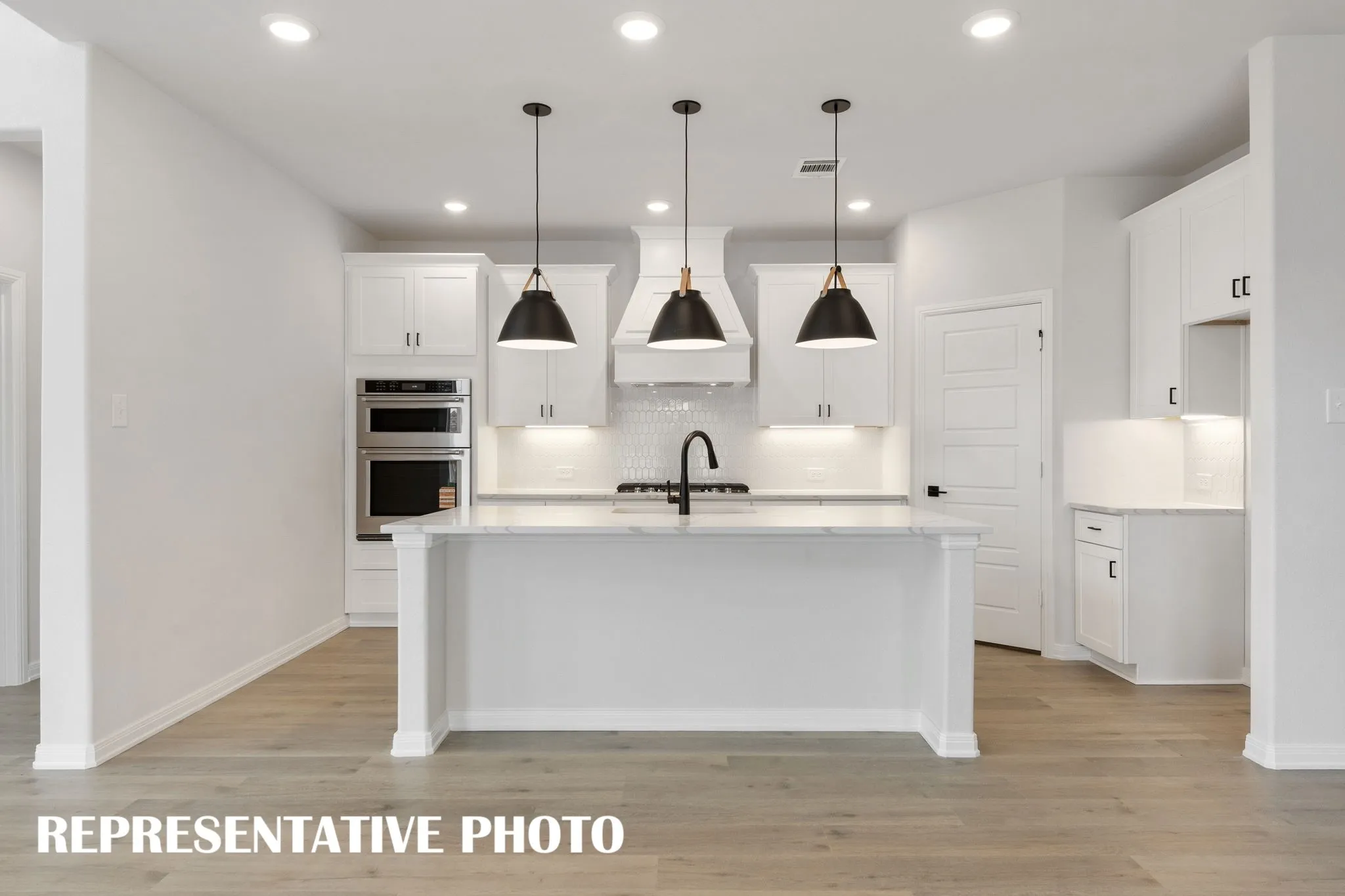 No shortage of space or style in this chef's dream kitchen!  REPRESENTATIVE PHOTO