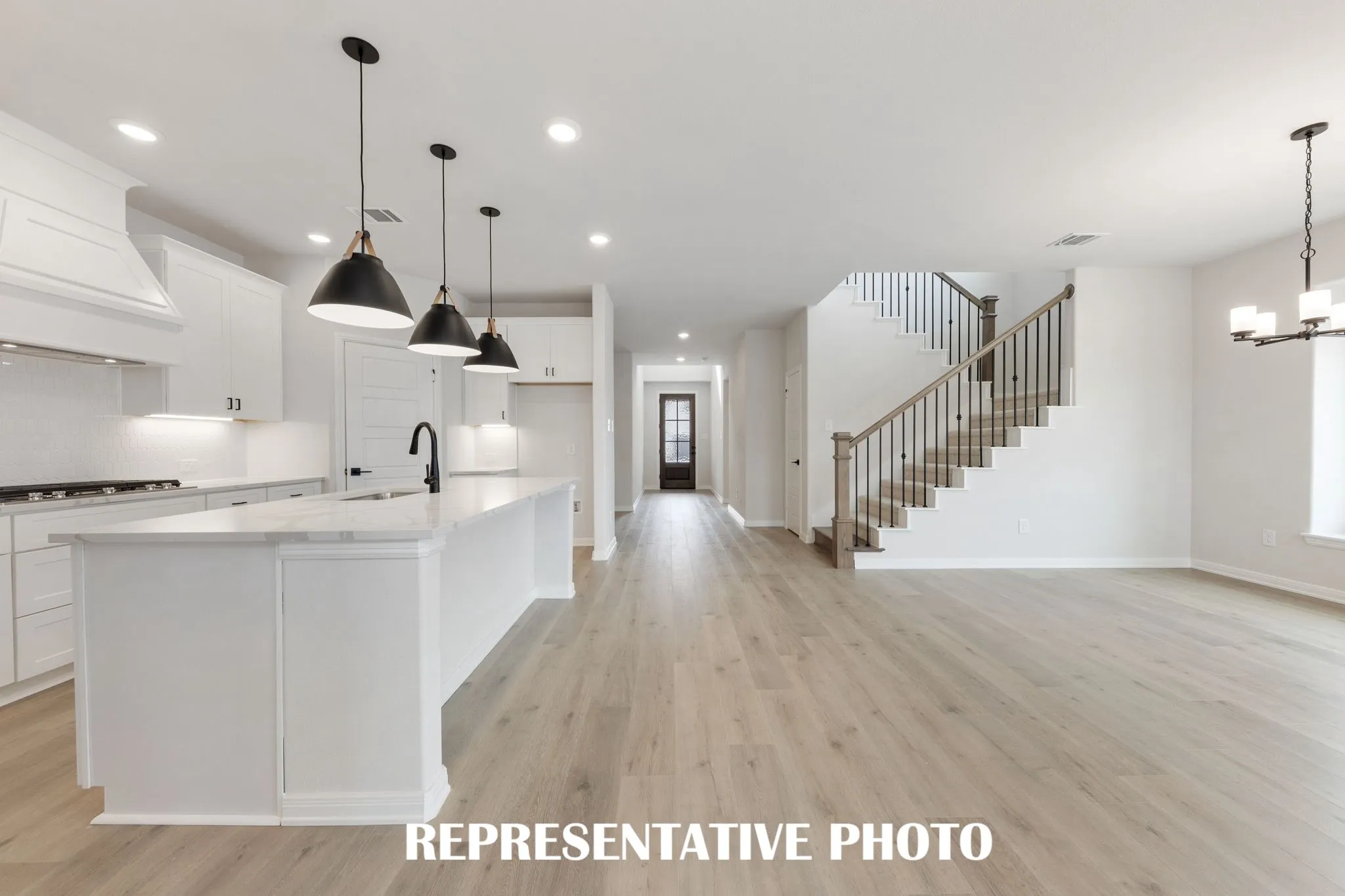 Featuring a stunning entry that leads directly to your light filled, open concept living area, our 4205 plan offers thoughtful design elements paired with luxurious finishes to create the perfect dream home!  REPRESENTATIVE PHOTO