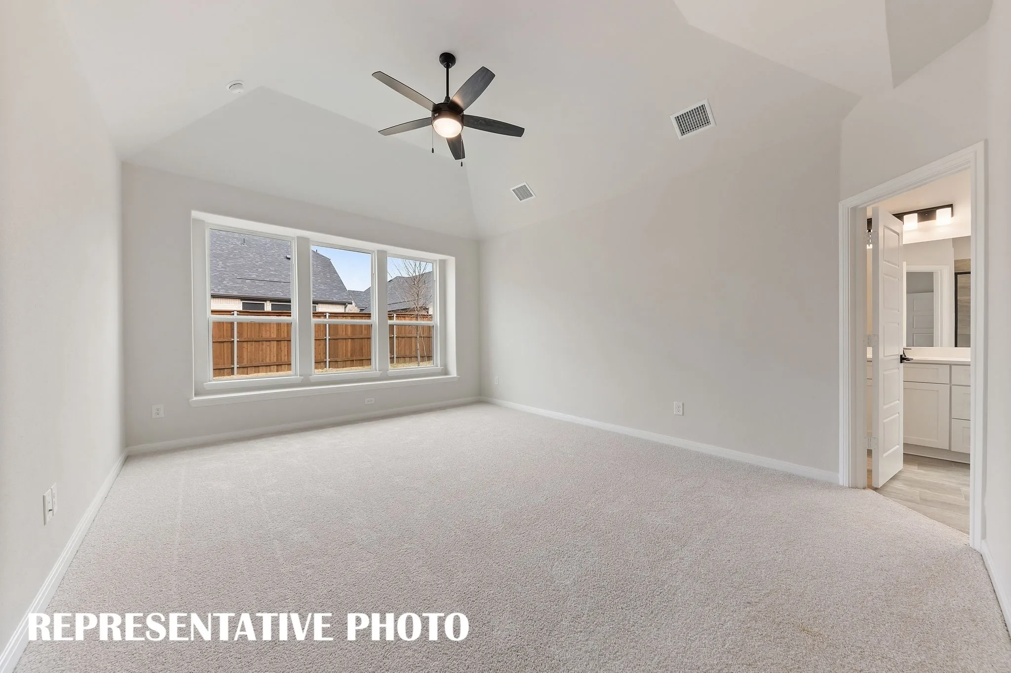 With high ceilings, oversized windows and plush carpeting, this owner's suite was designed for rest and relaxation.  REPRESENTATIVE PHOTO