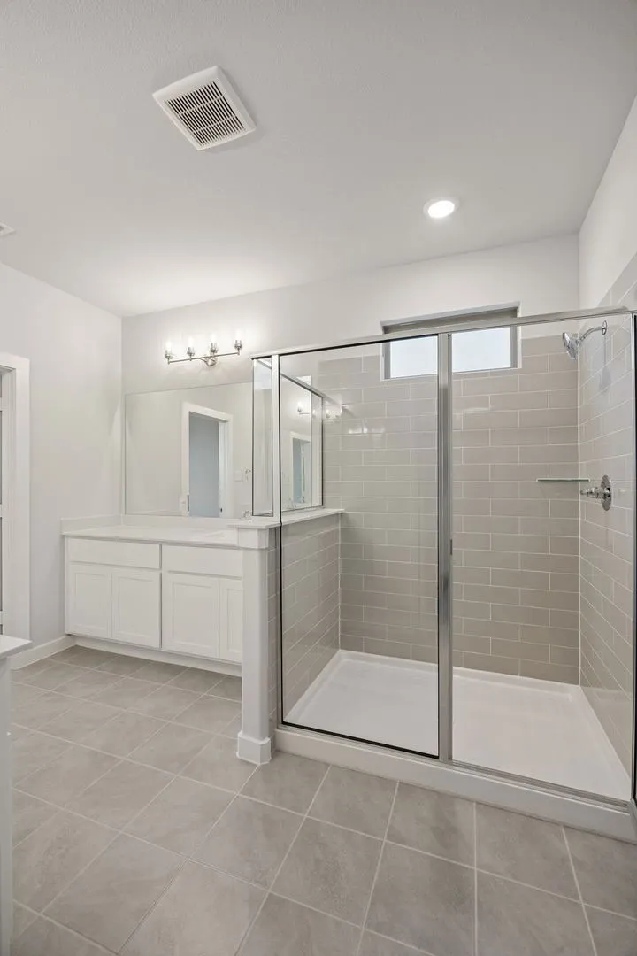 Primary Bathroom in the Wimbledon home plan by Trophy Signature Homes – REPRESENTATIVE PHOTO