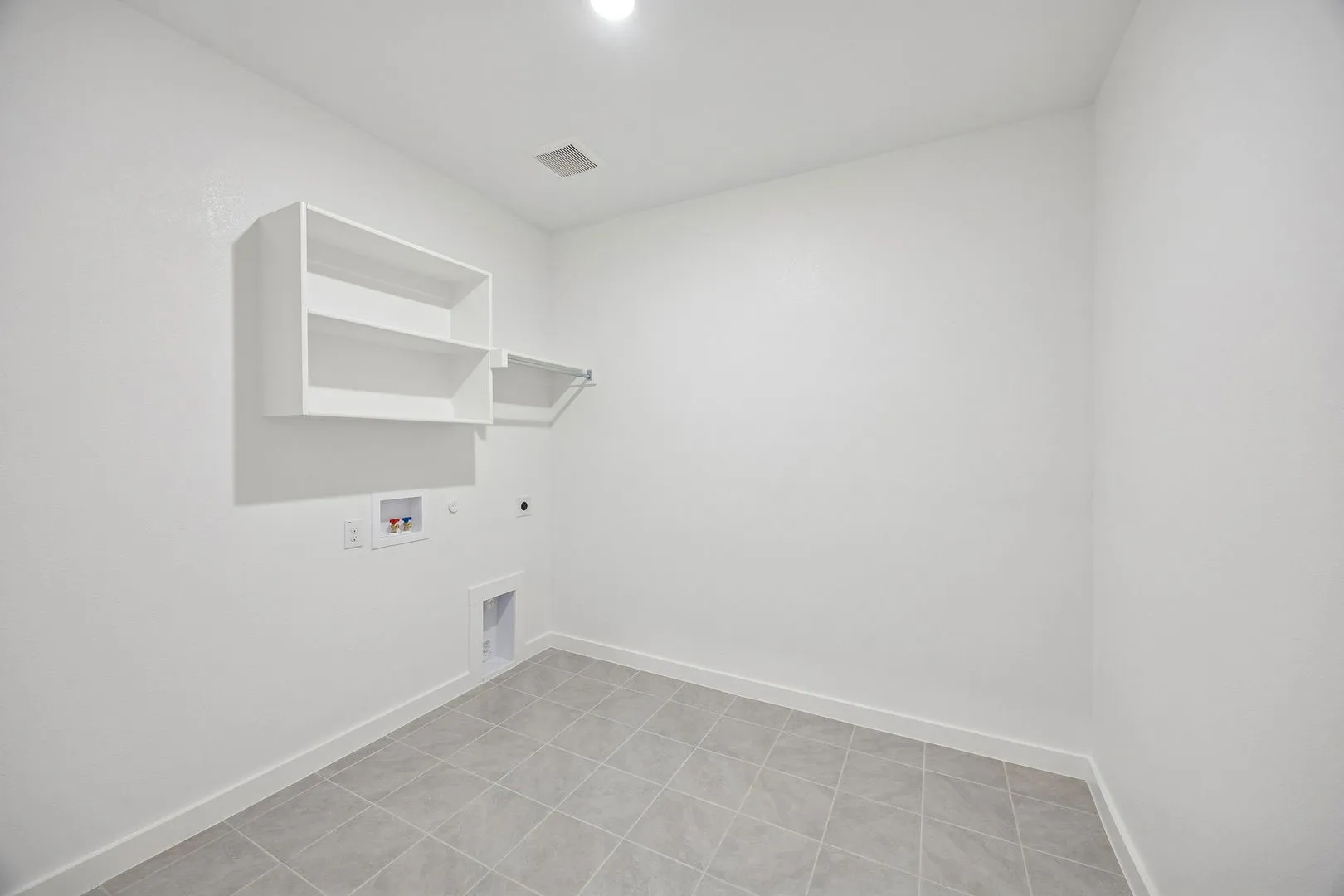 Utility Room in the Wimbledon home plan by Trophy Signature Homes – REPRESENTATIVE PHOTO