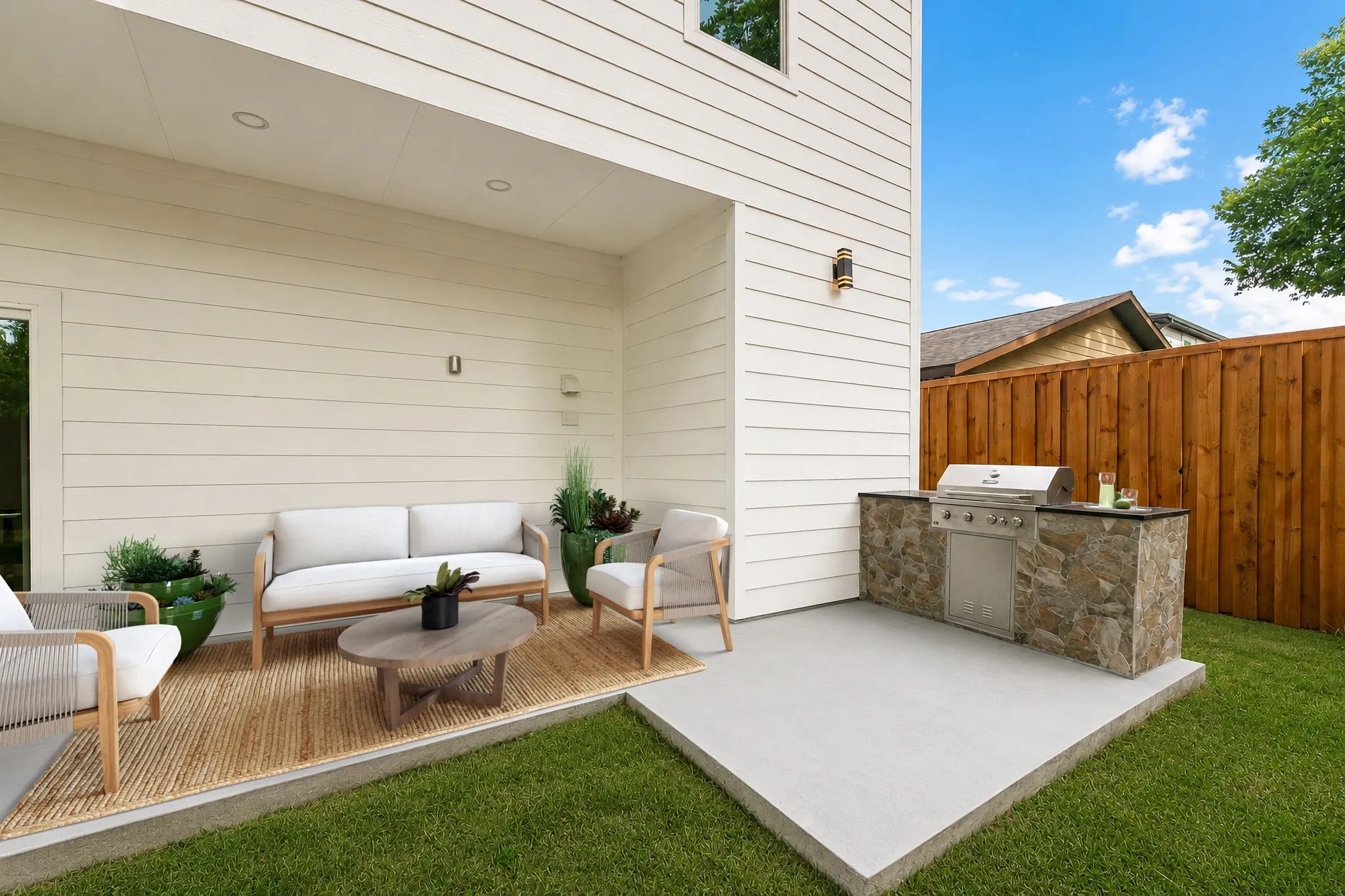 Covered Porch With Built-In Grill Which Has Been Virtually Staged.