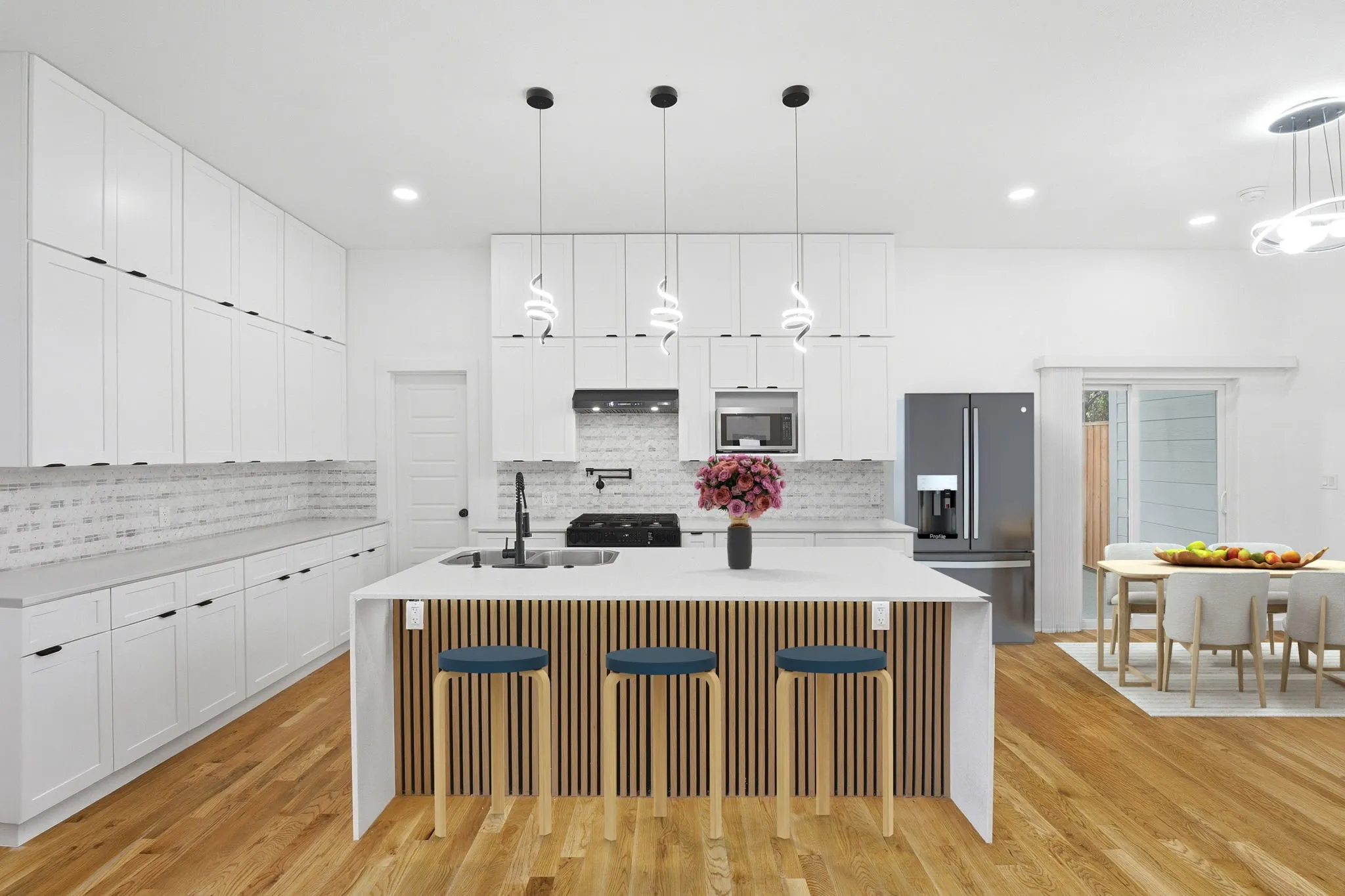 Huge Kitchen With Center Island and Dining Area Which Has Been Virtually Staged.