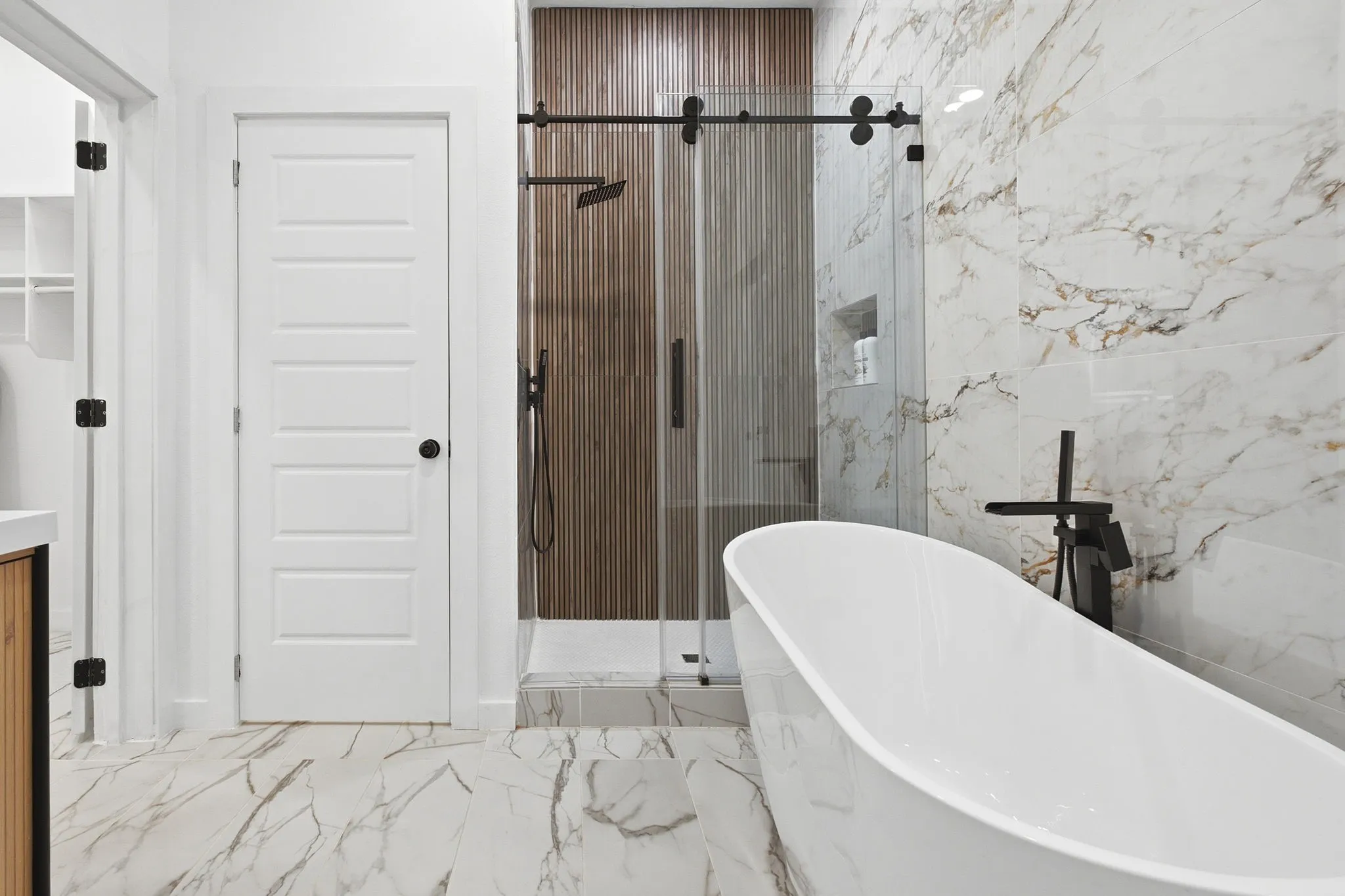 2nd Floor Primary Bedroom Ensuite Showcasing Free Standing Tub and Shower.