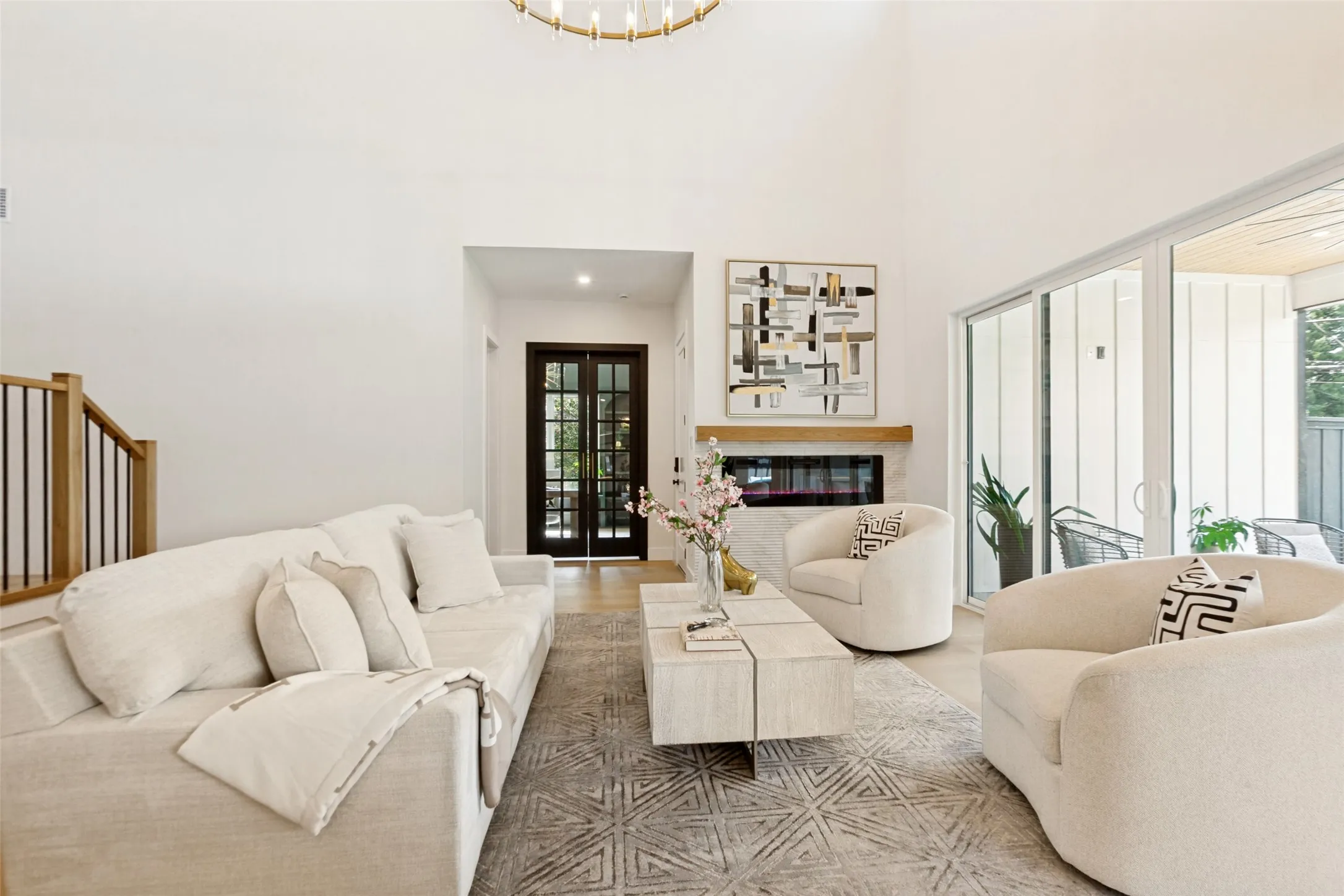 Vaulted ceiling with an overhead designer chandelier.