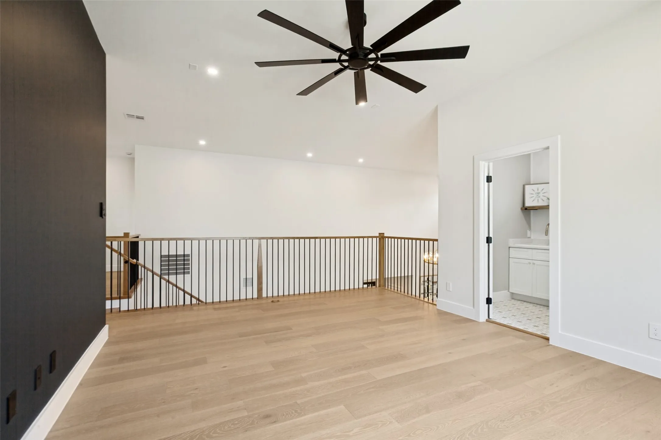 2nd floor living space with large oversize designer fan.
