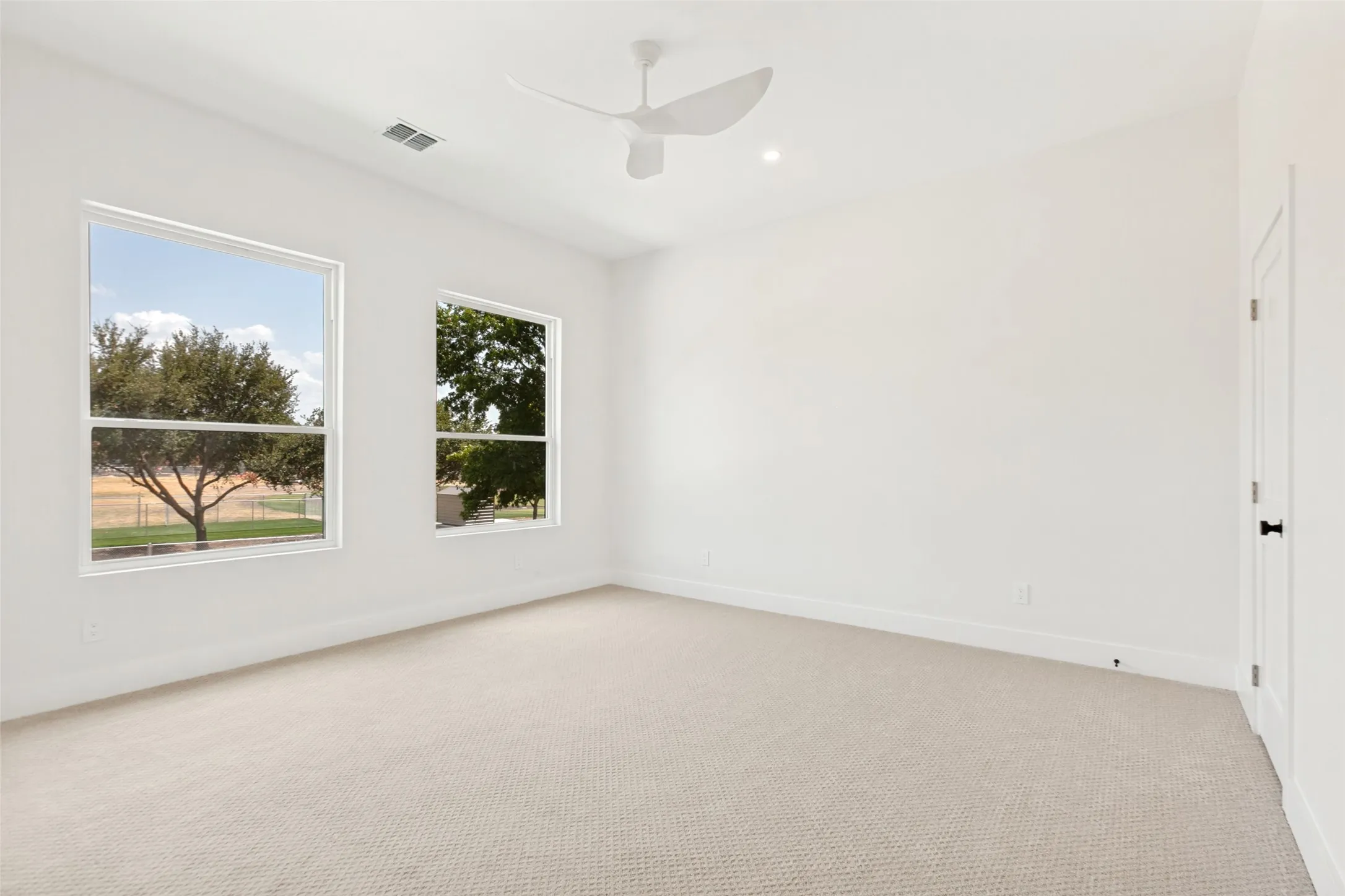 Bedroom #4 with modern designer fan.