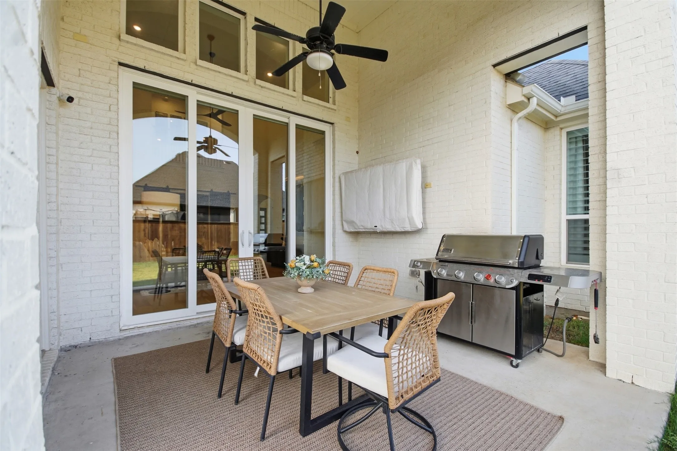Extended back porch with sliding glass doors, gas line for out door grilling, vaulted ceilings, and a perfect space for entertaining!