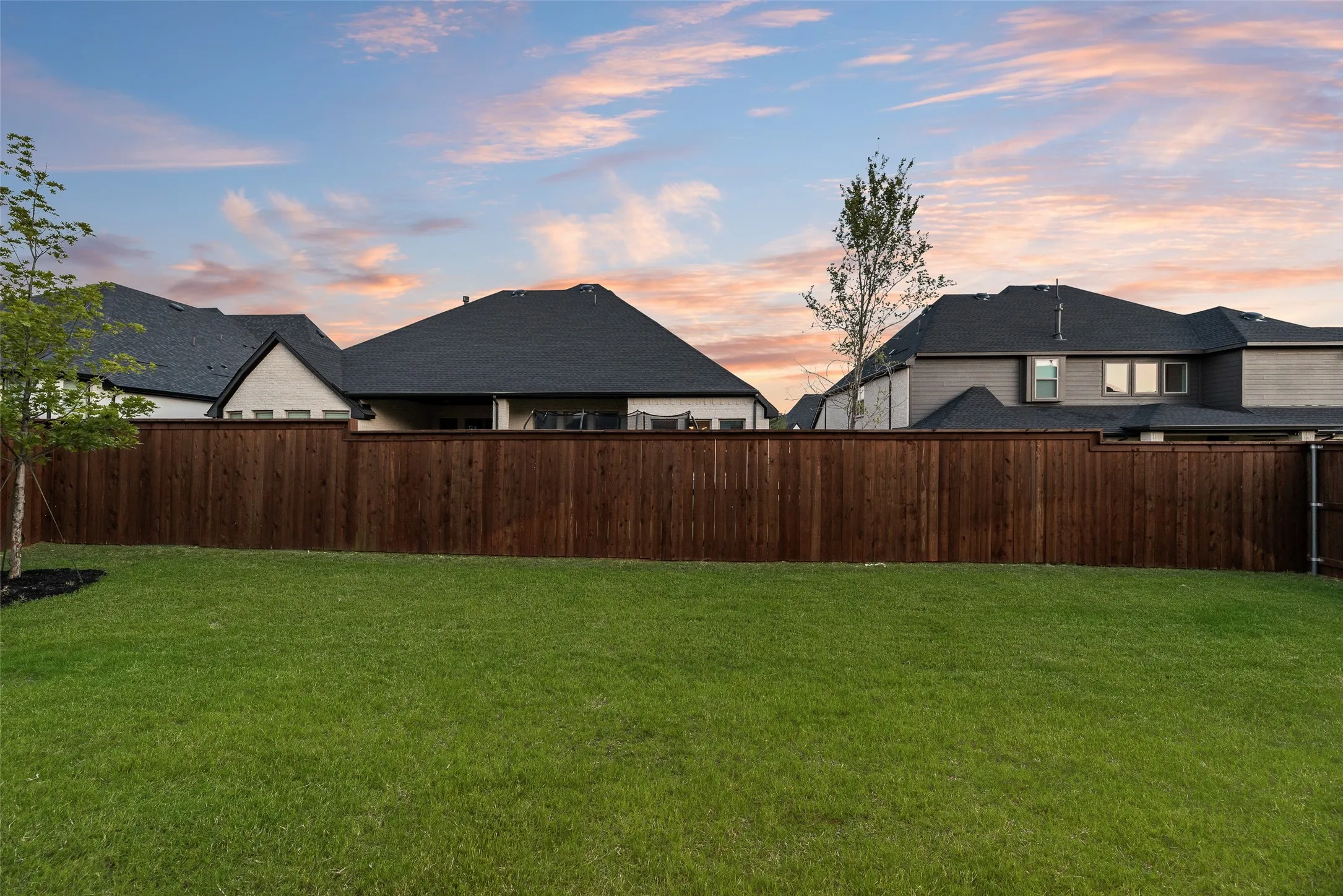 Expansive green lawn providing ample outdoor space