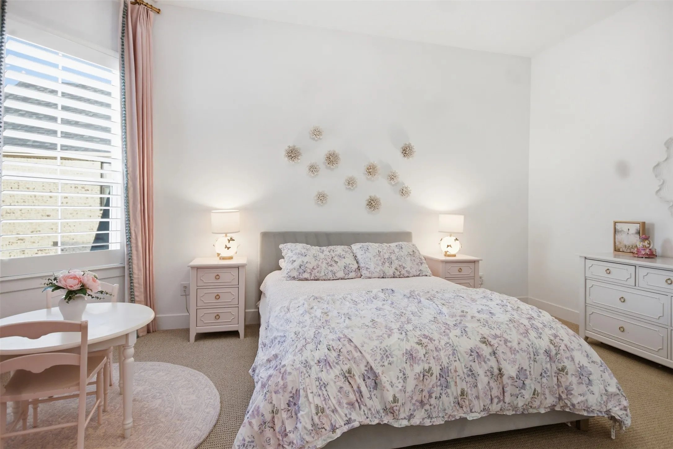 Bedroom featuring neutral carpeting and white walls