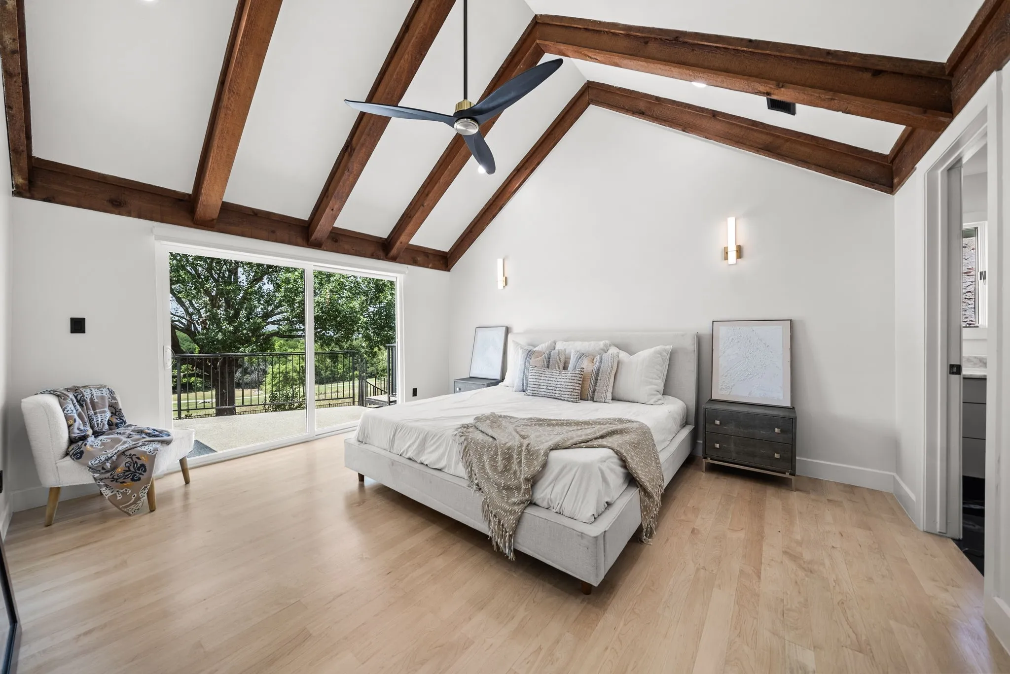 Vaulted white ceilings with exposed wood beams