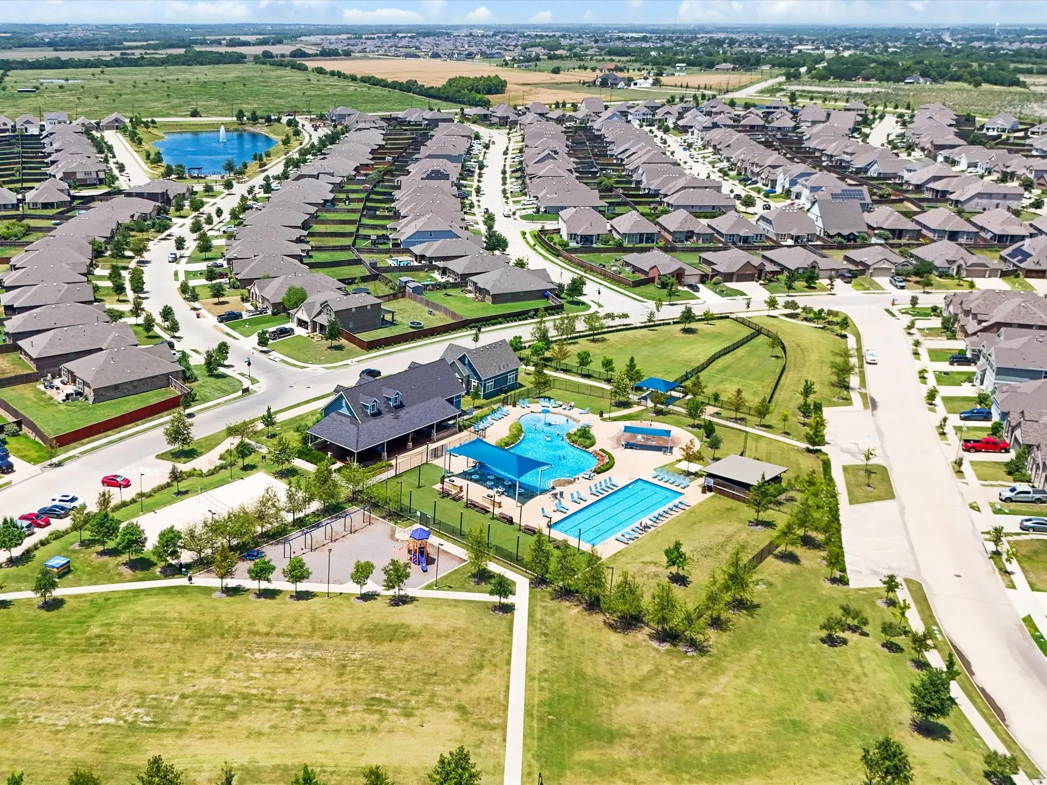 Community amenities featuring a clubhouse, two swimming pools, and a playground
