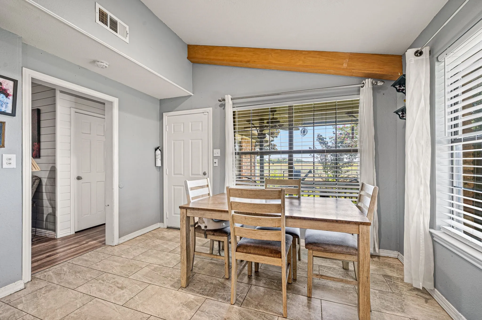 Covered patio off breakfast area to enjoy morning coffee