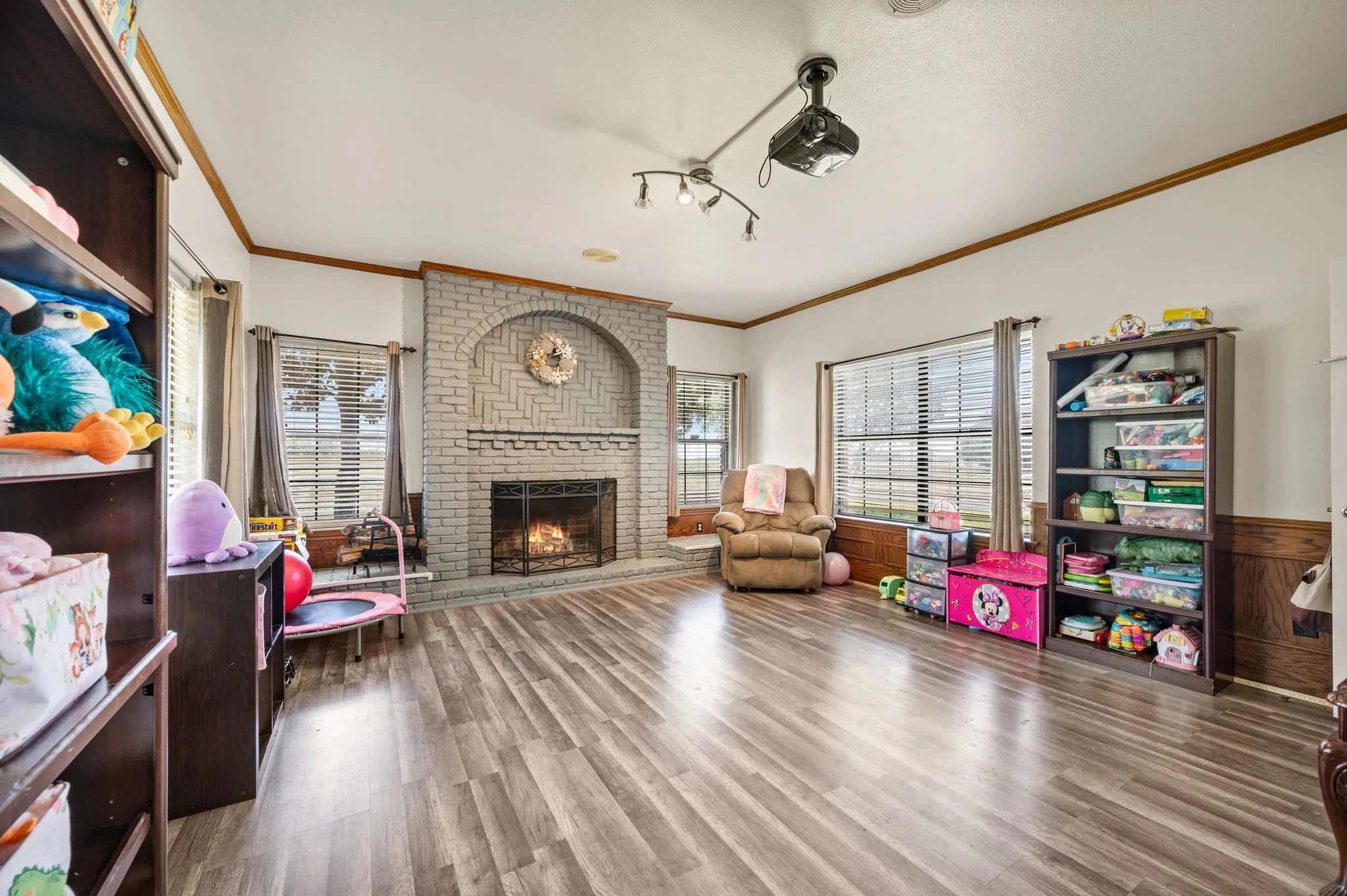 Family room with woodburning fireplace and wet bar