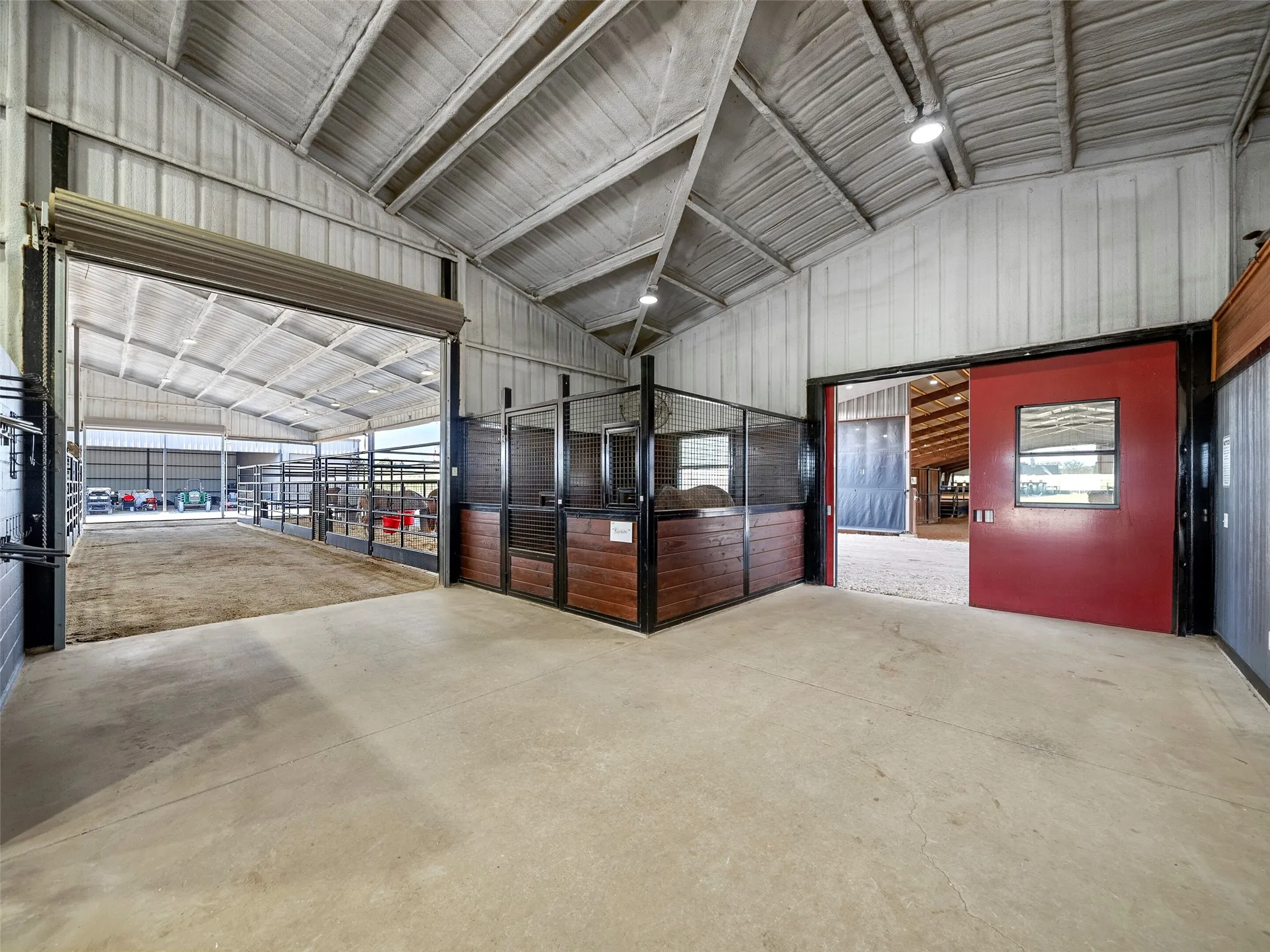MAIN BARN INTERIOR...Views Of Entrance To Mare Motel Stalls, Plus Breezeway Entrance Into Covered Arena
