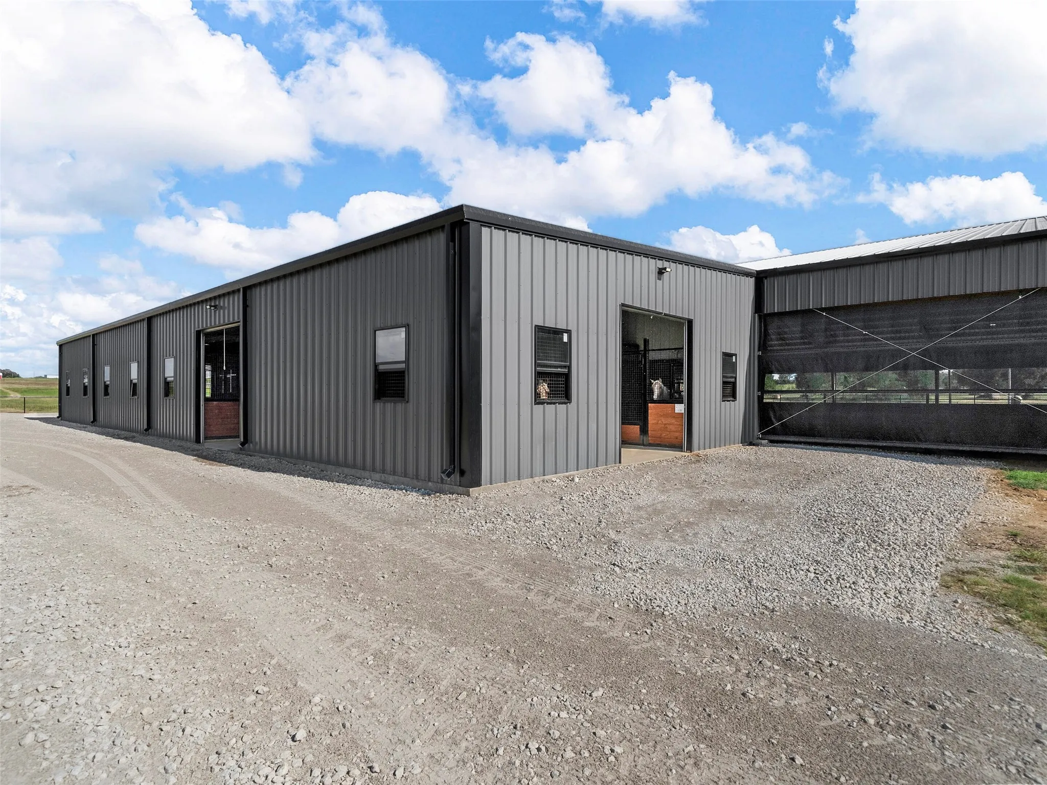 2ND SHOW BARN...12 Stalls, Located At Side Of Cvrd Arena W/Direct Access, Insulated, Auto Waterers, Corner Feeders, Stall Mats, Fly System, Wash Rack With Hot/Cold Water, Tack Room