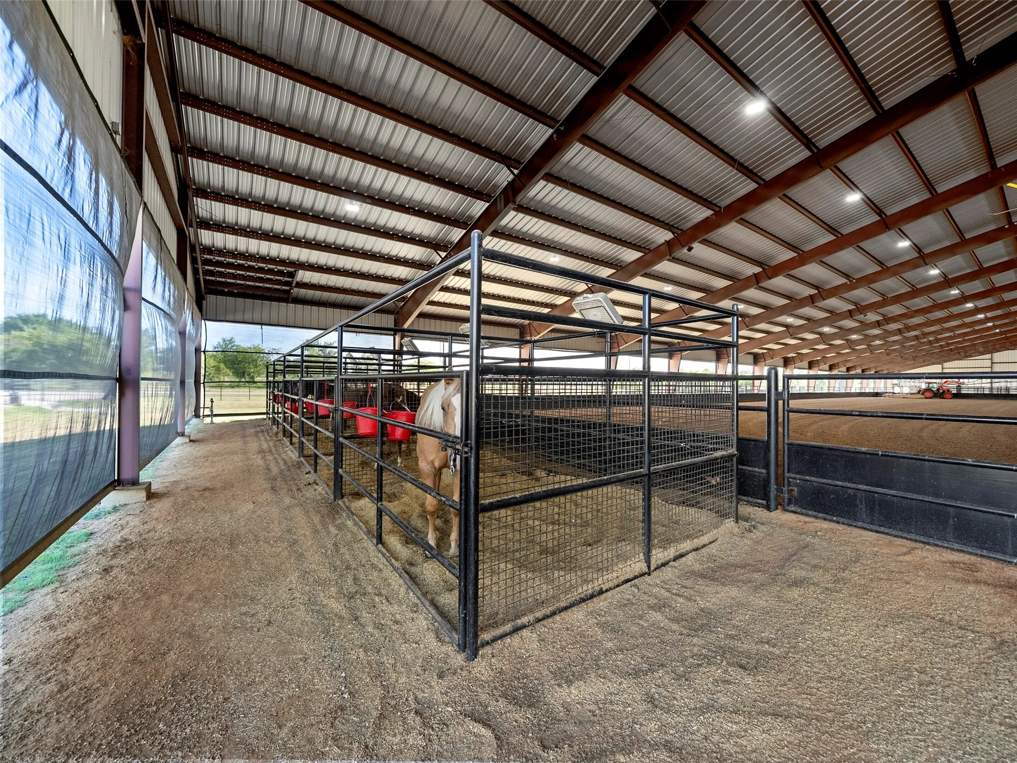 STALLS INSIDE COVERED ARENA...Five - Pipe/Welded Wire Stalls, Plus Stall Mats