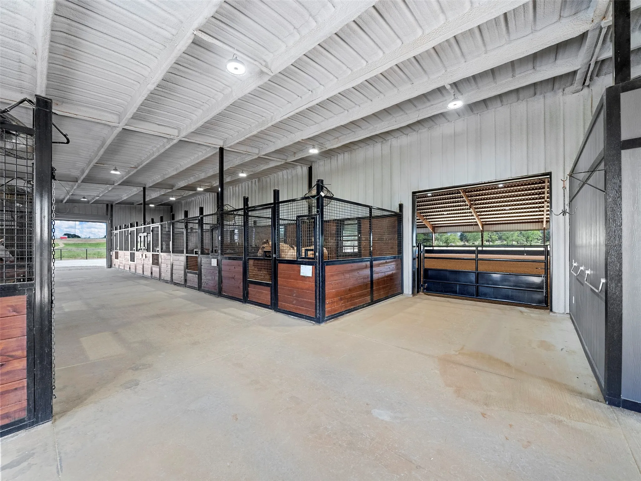 2ND SHOW BARN INTERIOR...View Of Direct Access Into Covered Arena