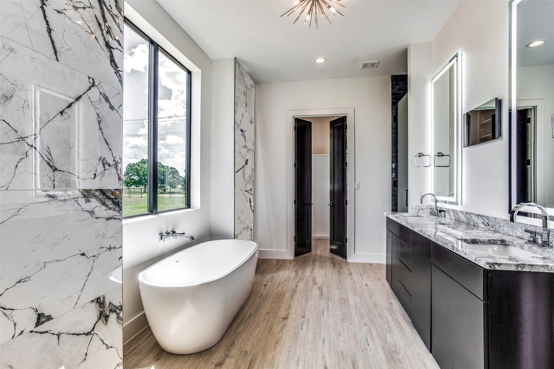 PRIMARY BATH...Double Vanity W/Granite Top, Free Standing Soaking Tub, Tile Shower, Walk-In Closet