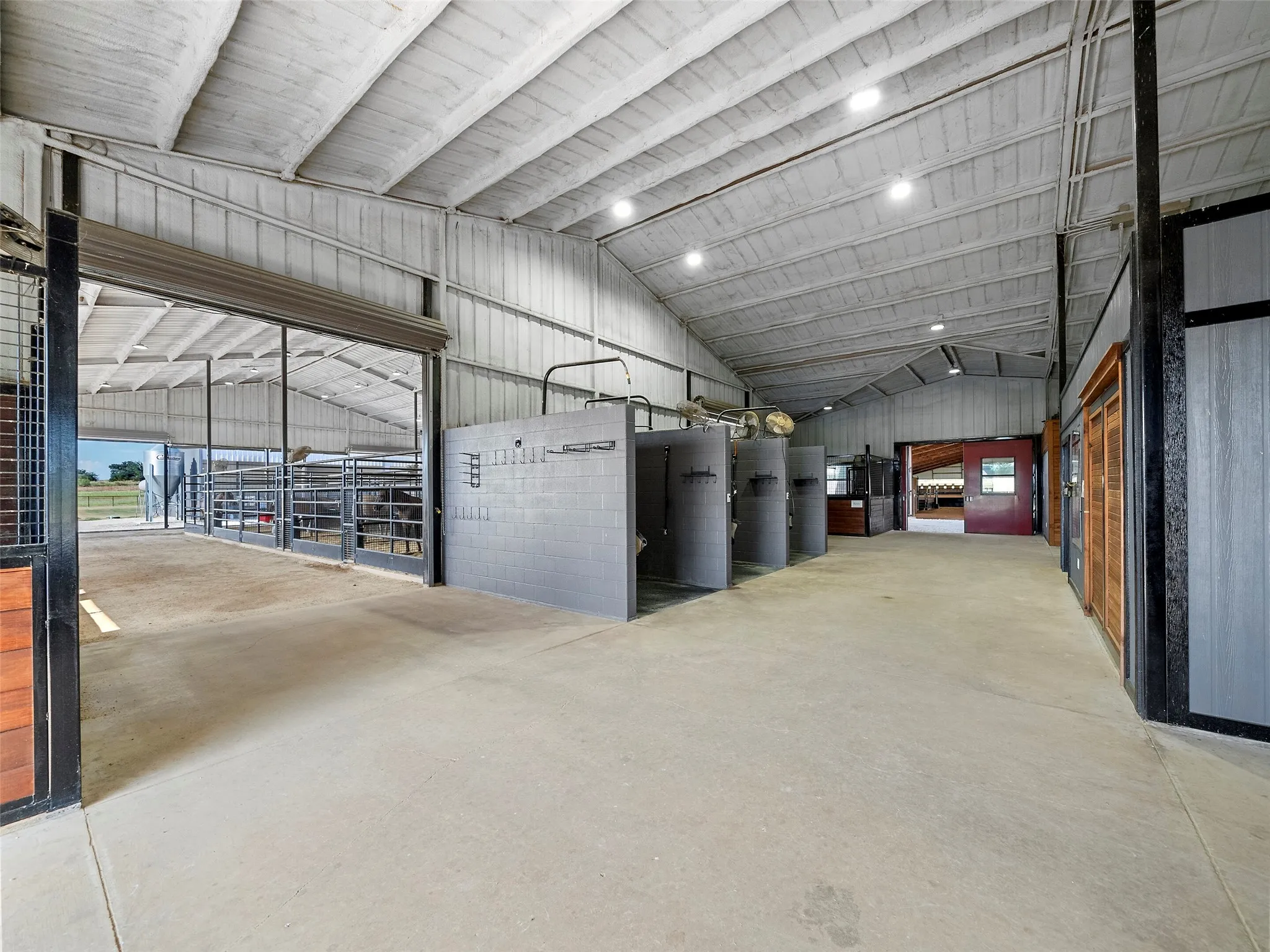 MAIN BARN INTERIOR...Views Of Entrance Into Mare Motel Stalls, Plus 3 Bay Wash Racks With Hot/Cold Water
