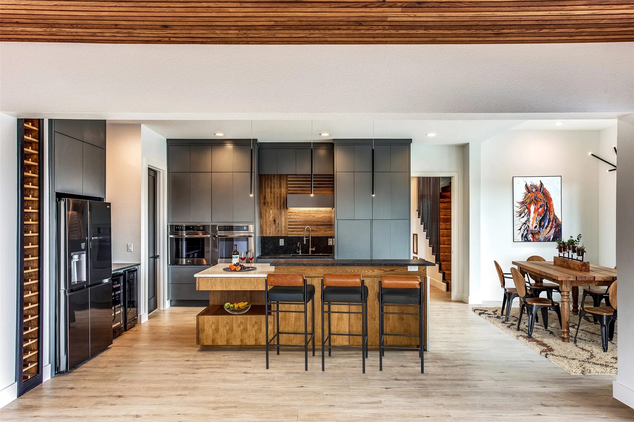 KITCHEN AND DINETTE...Granite Tops, Stainless Appliances, B/I Wine Rack, Wine Fridge, Breakfast Bar, W/I Pantry