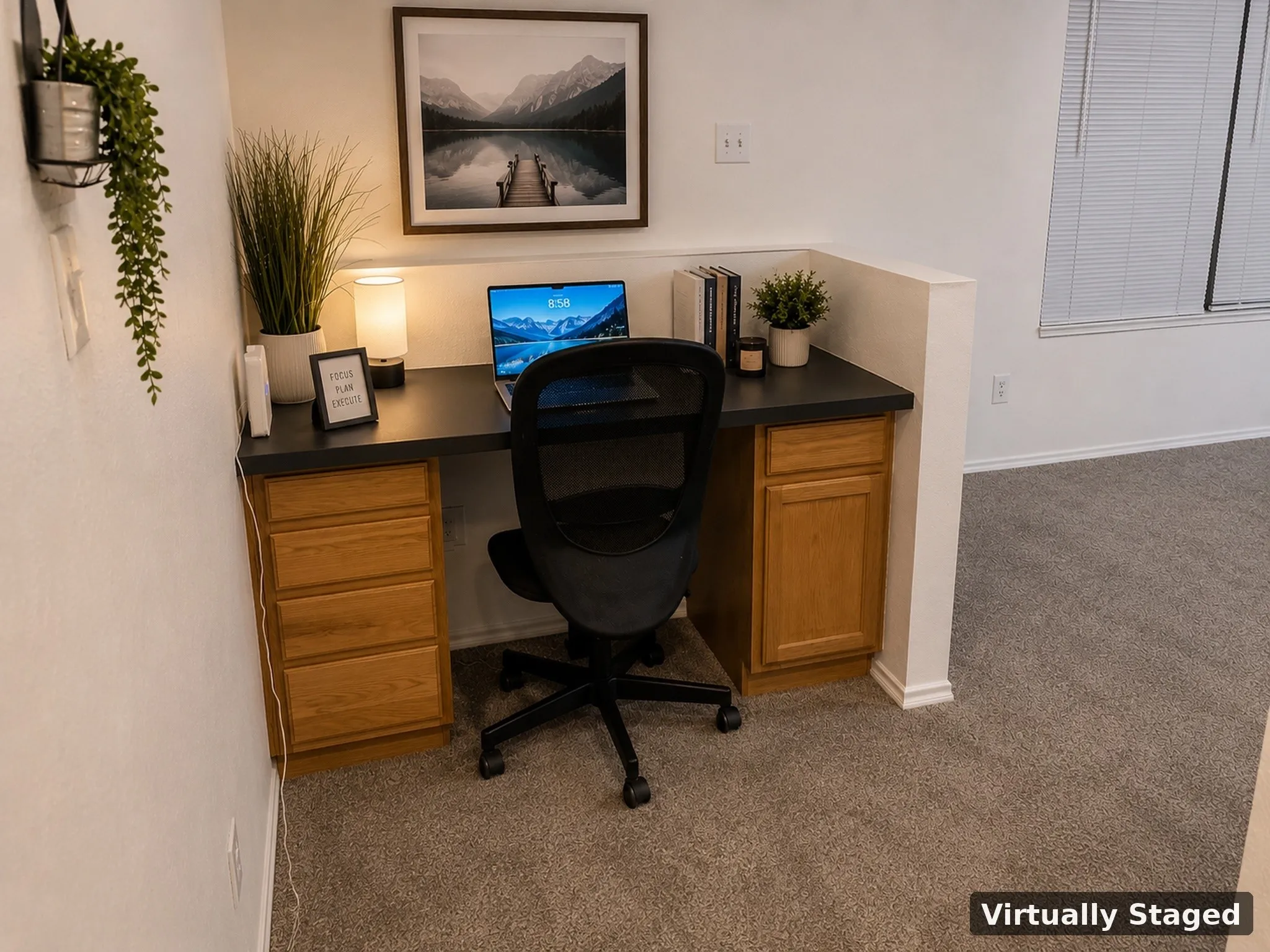 Built-in desk area featuring wood cabinetry, a dark countertop, and light-colored carpeting