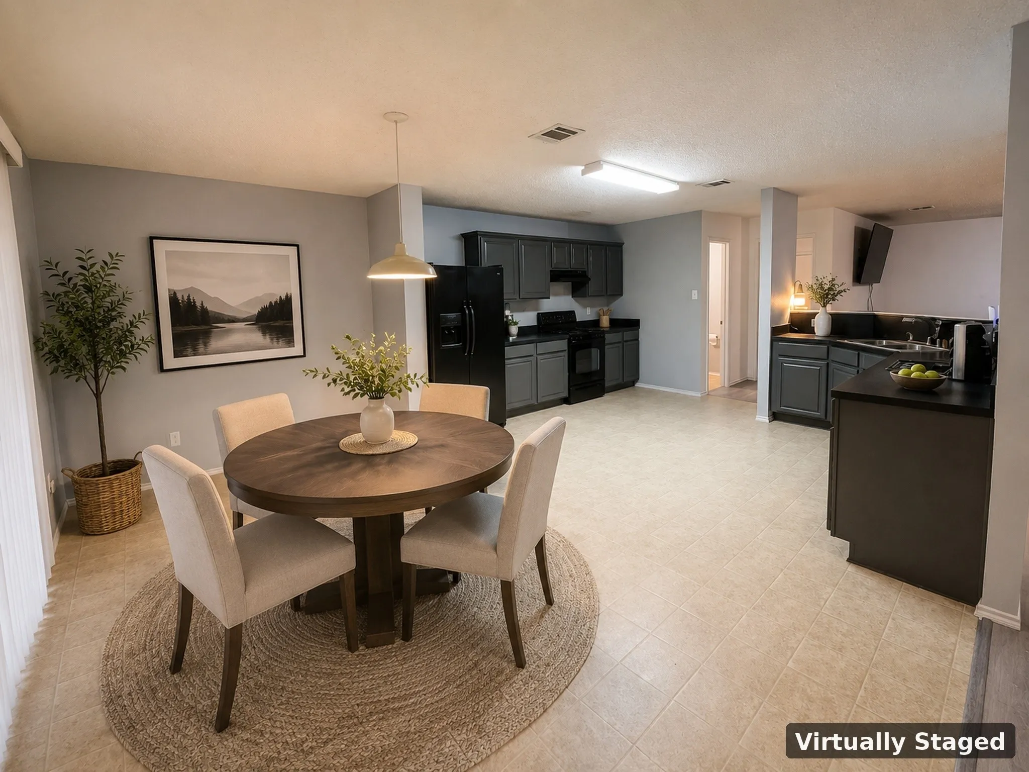 Open-concept living space with tiled flooring and a neutral color palette