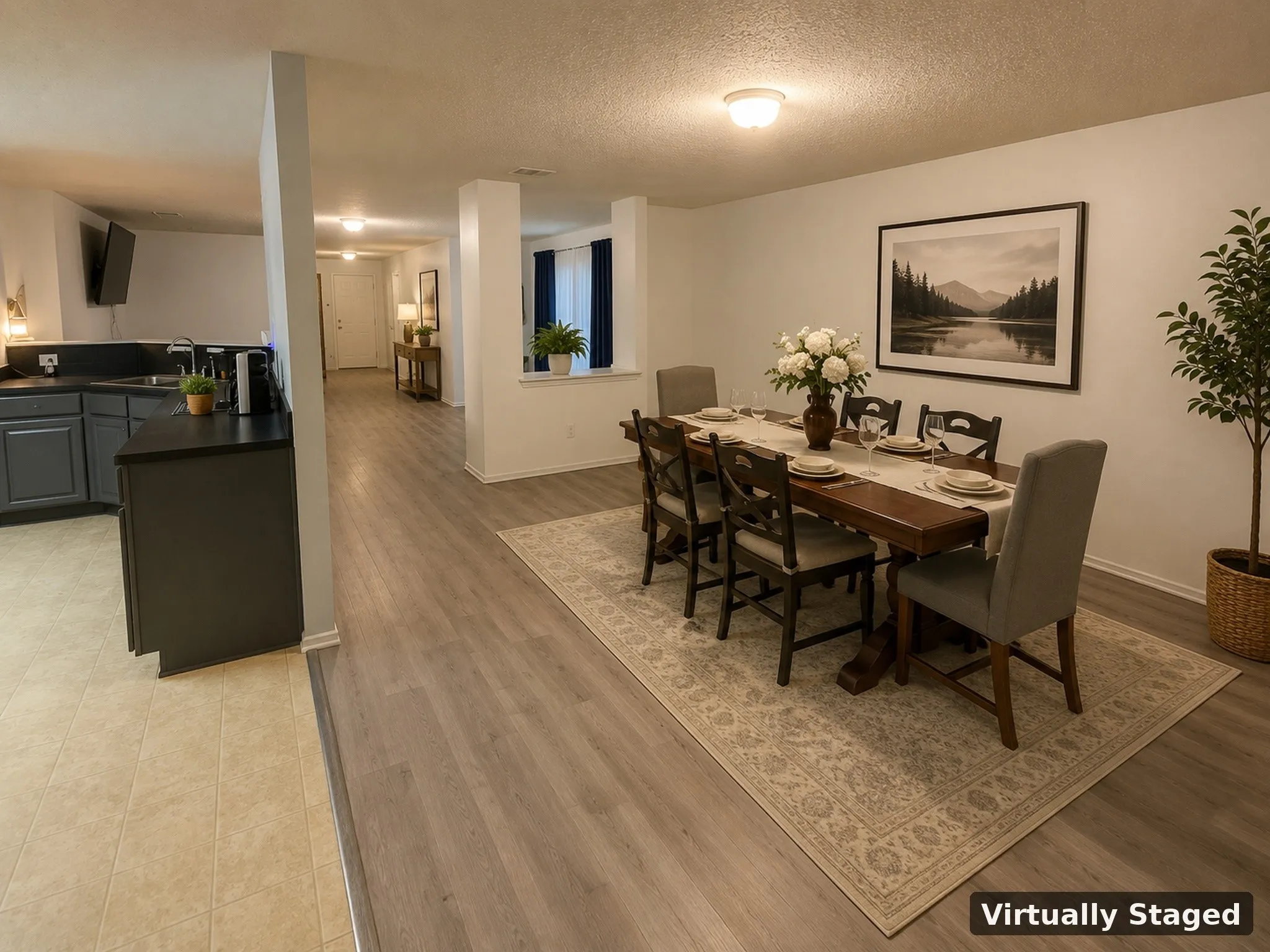 Open-concept living space featuring wood-finish flooring, recessed lighting, and a neutral color palette