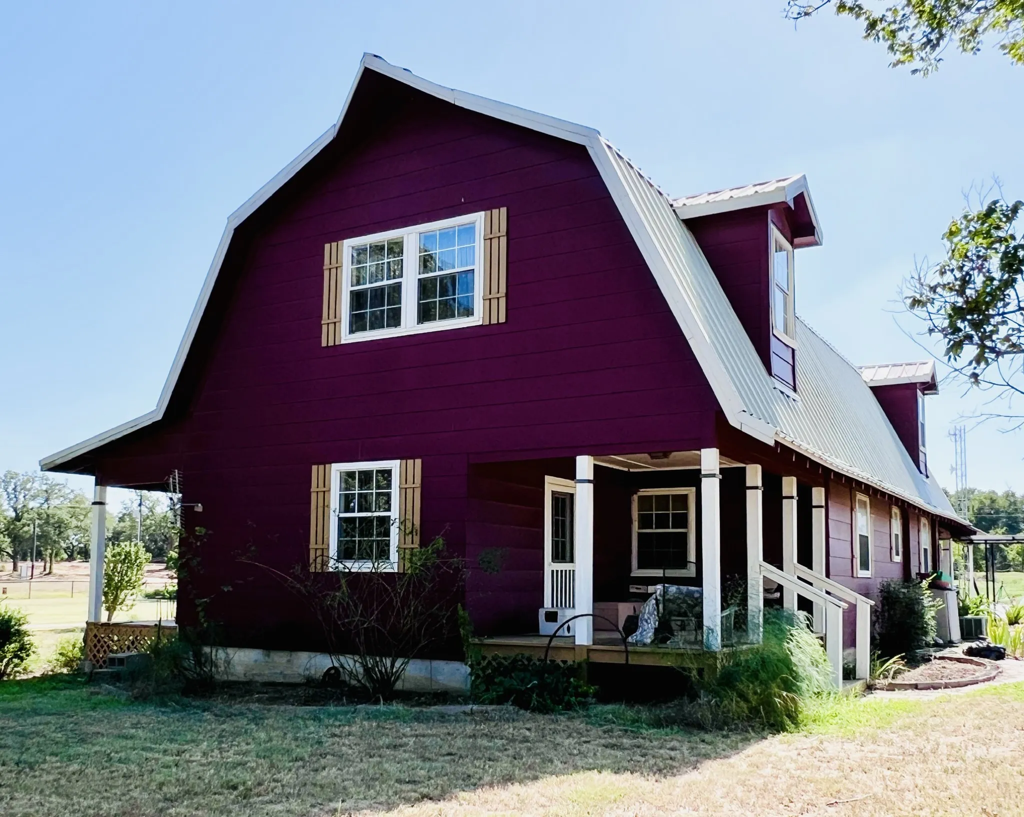 East side of the house with small porch and entry door to living room