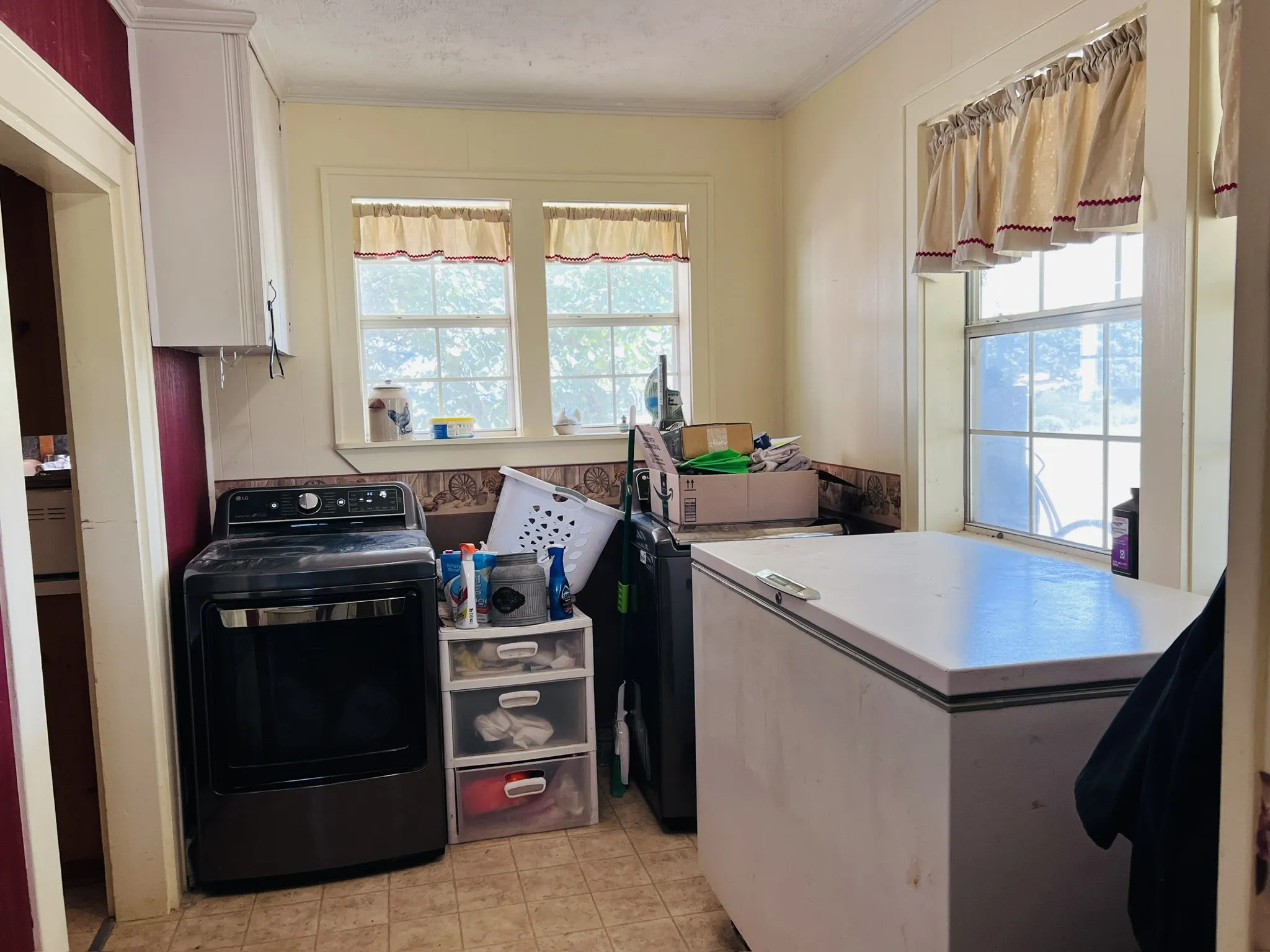 Laundry off kitchen with room for freezer. Back door entry.