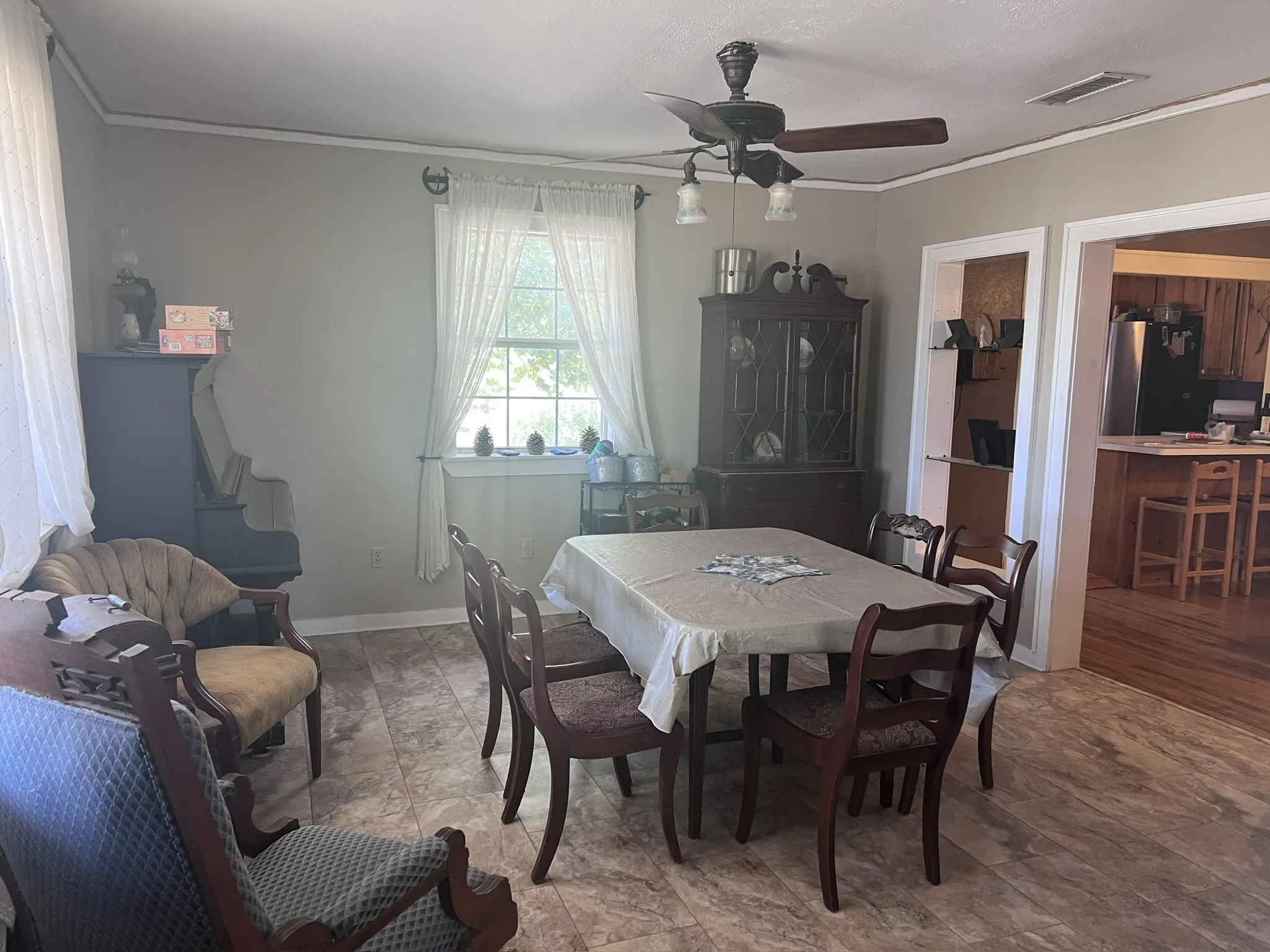 Dining area with laminate flooring, a window with natural light