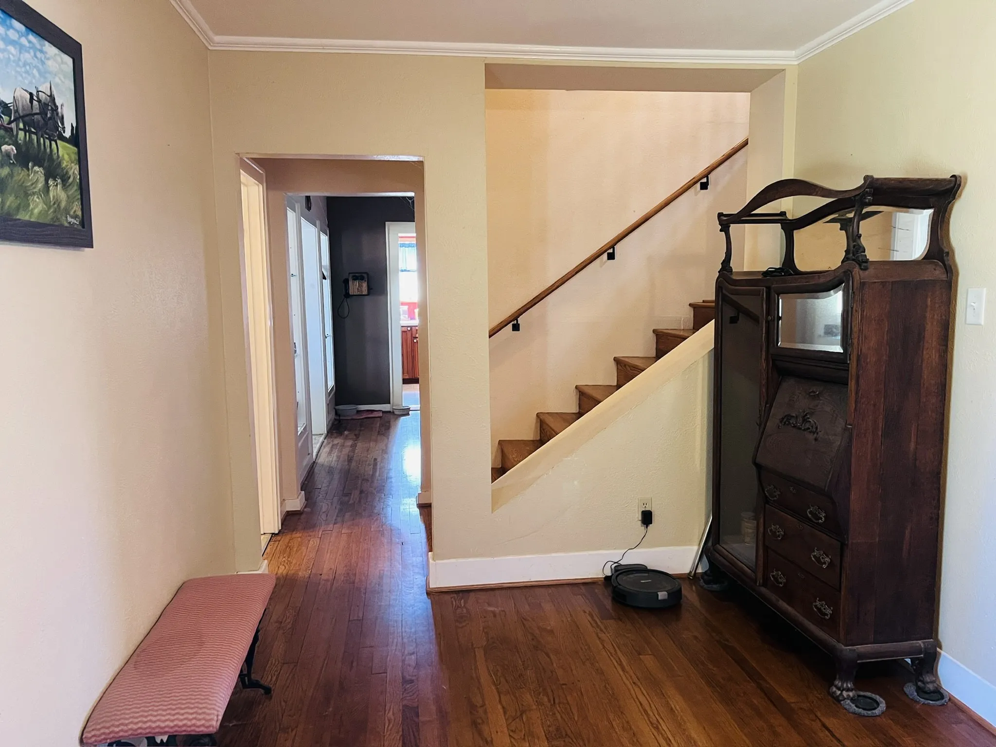 Living room looking at stairs and entry to eating area