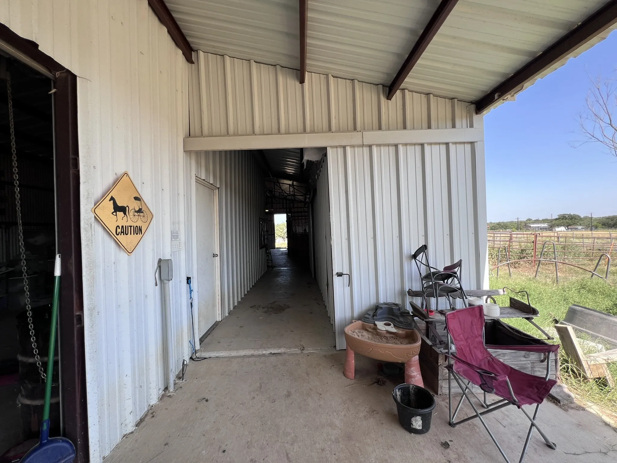 Hallway that enters stable and feed area