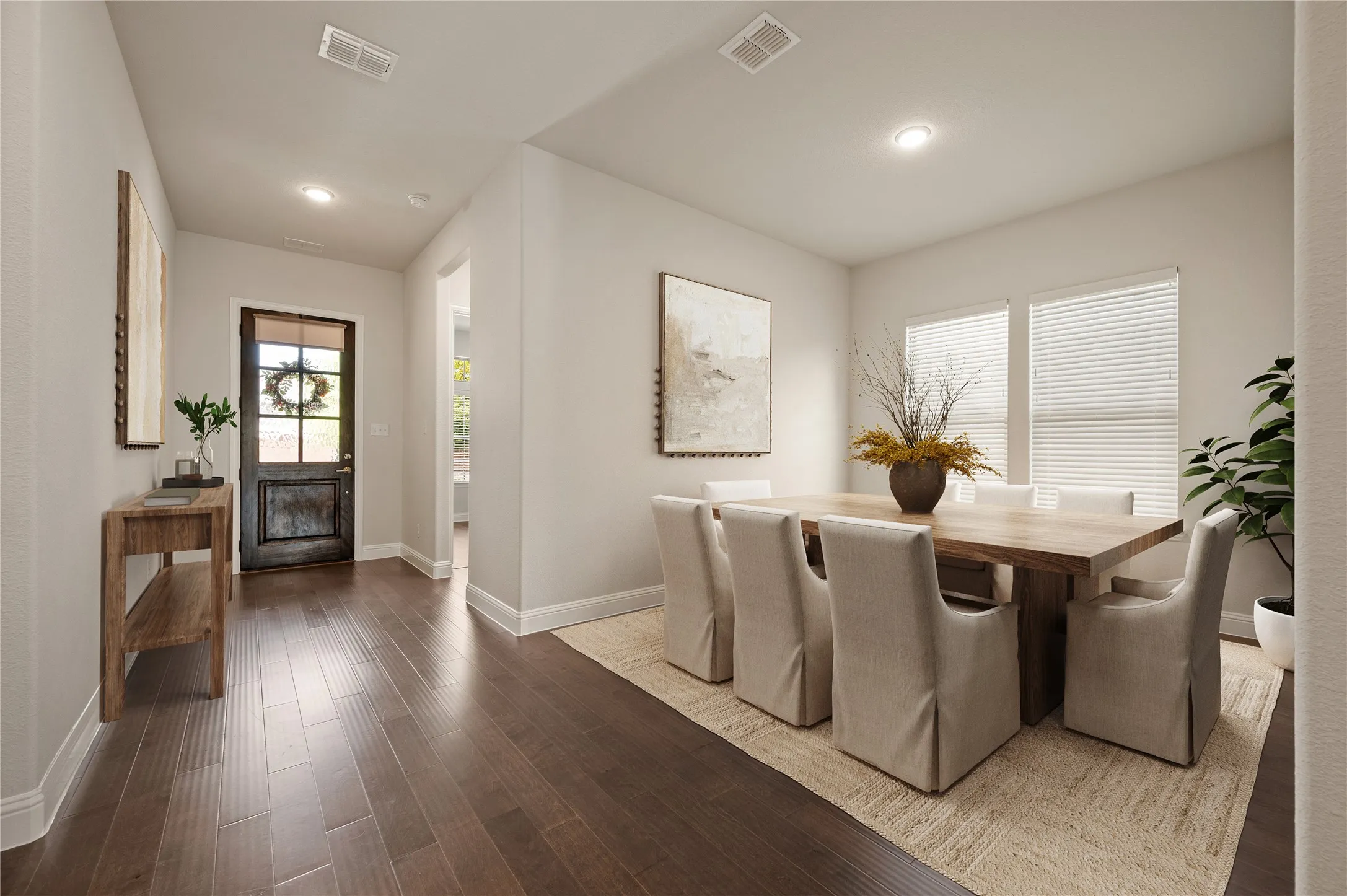 Staged entry and dining room photo
