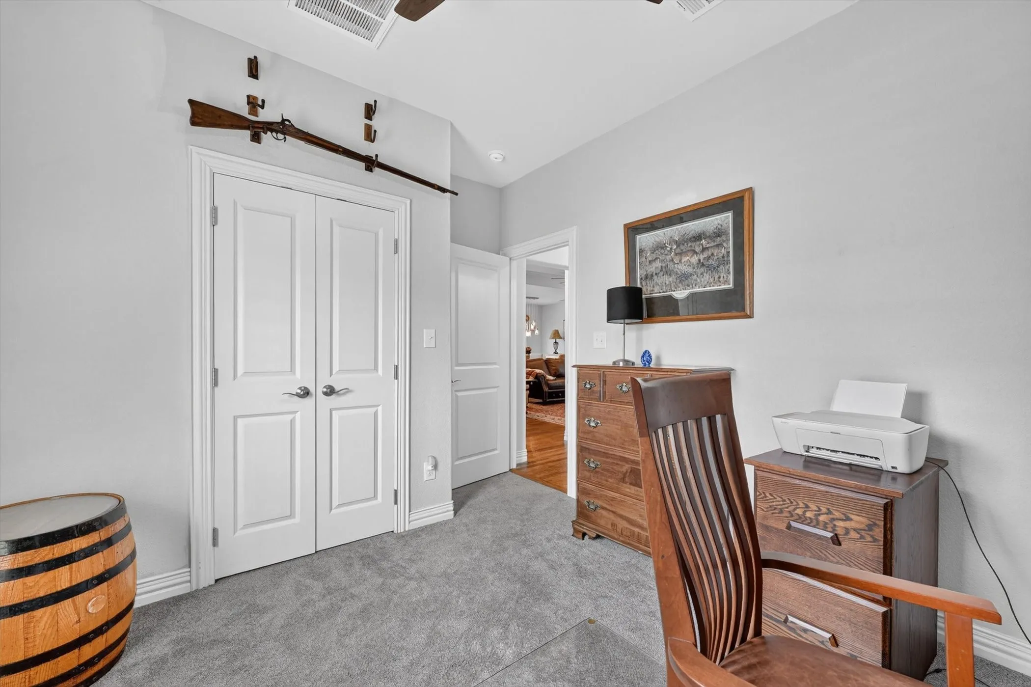 Room featuring gray wall paint, gray carpet, and white baseboards