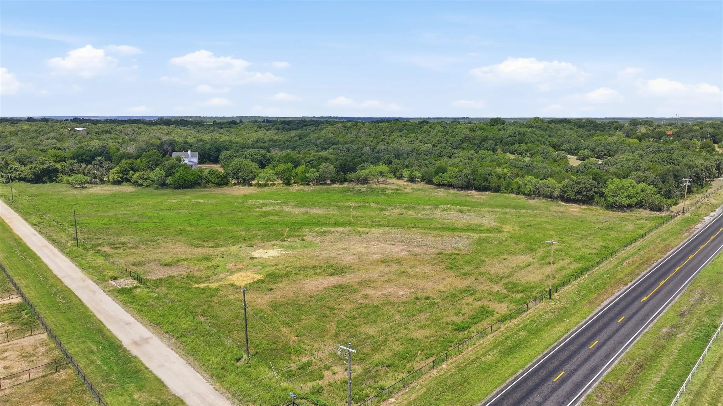View of the front pasture/acreage. The road in view is FM-113.