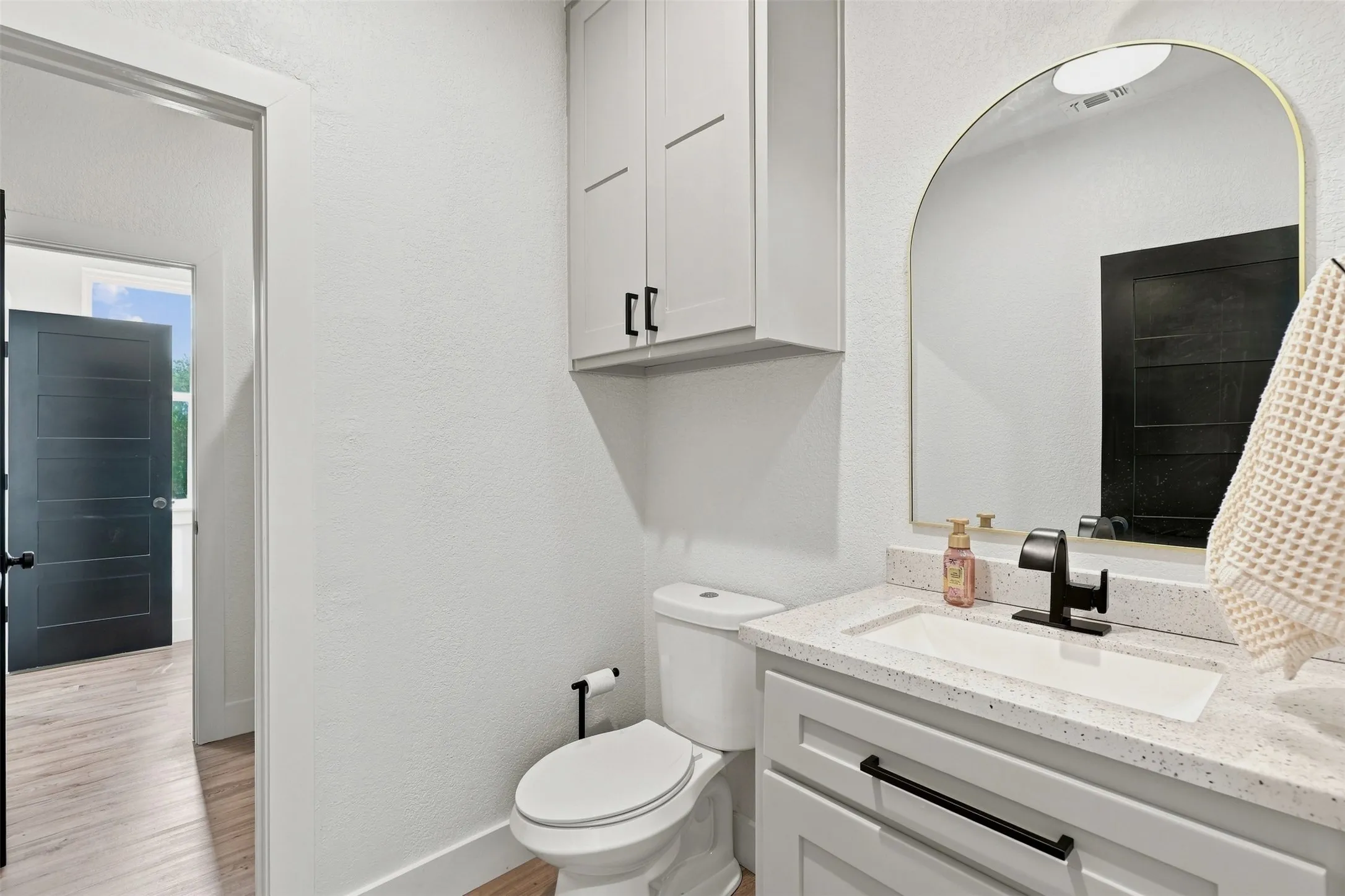 Upstairs Hollywood-style bathroom offers dual private vanity/toilet areas connected by the shared tub/shower in between.