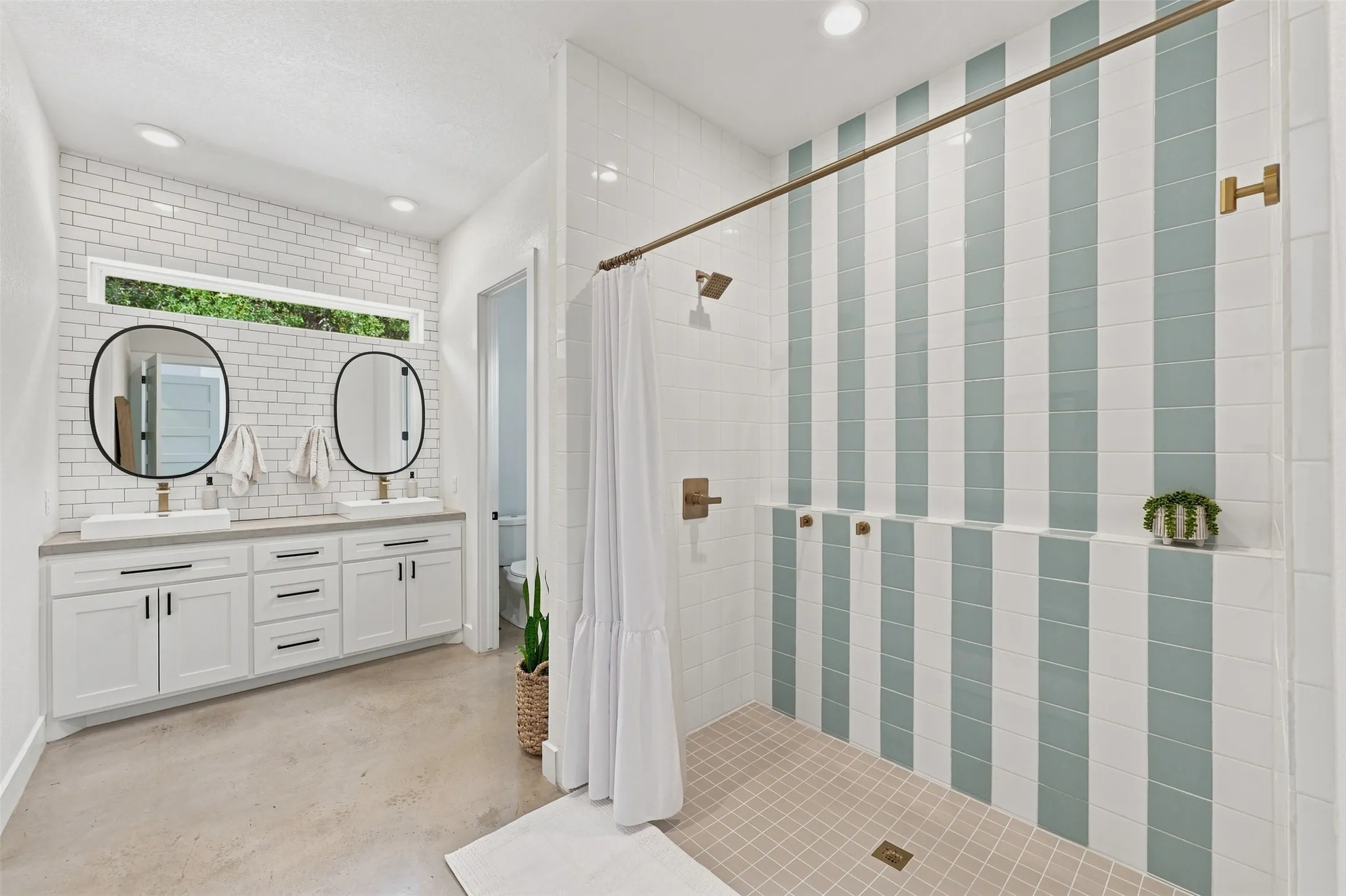 Ensuite bath features an oversized shower, dual sinks and oversized walk-in closet with built-ins.