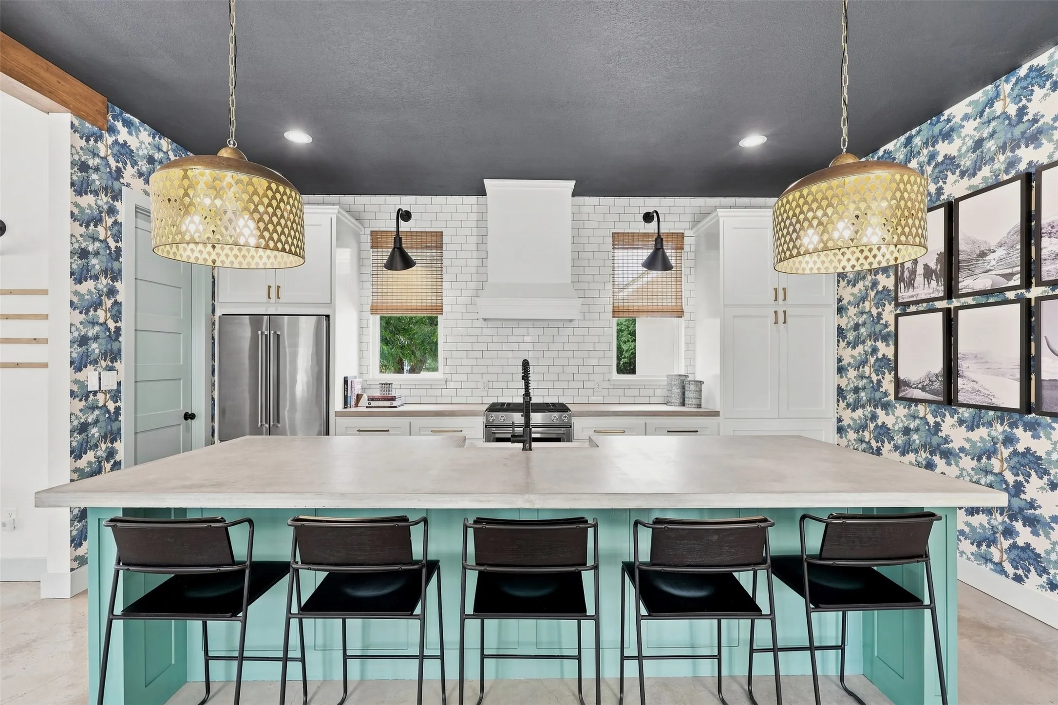 Beautiful concrete island and farmstyle sink.