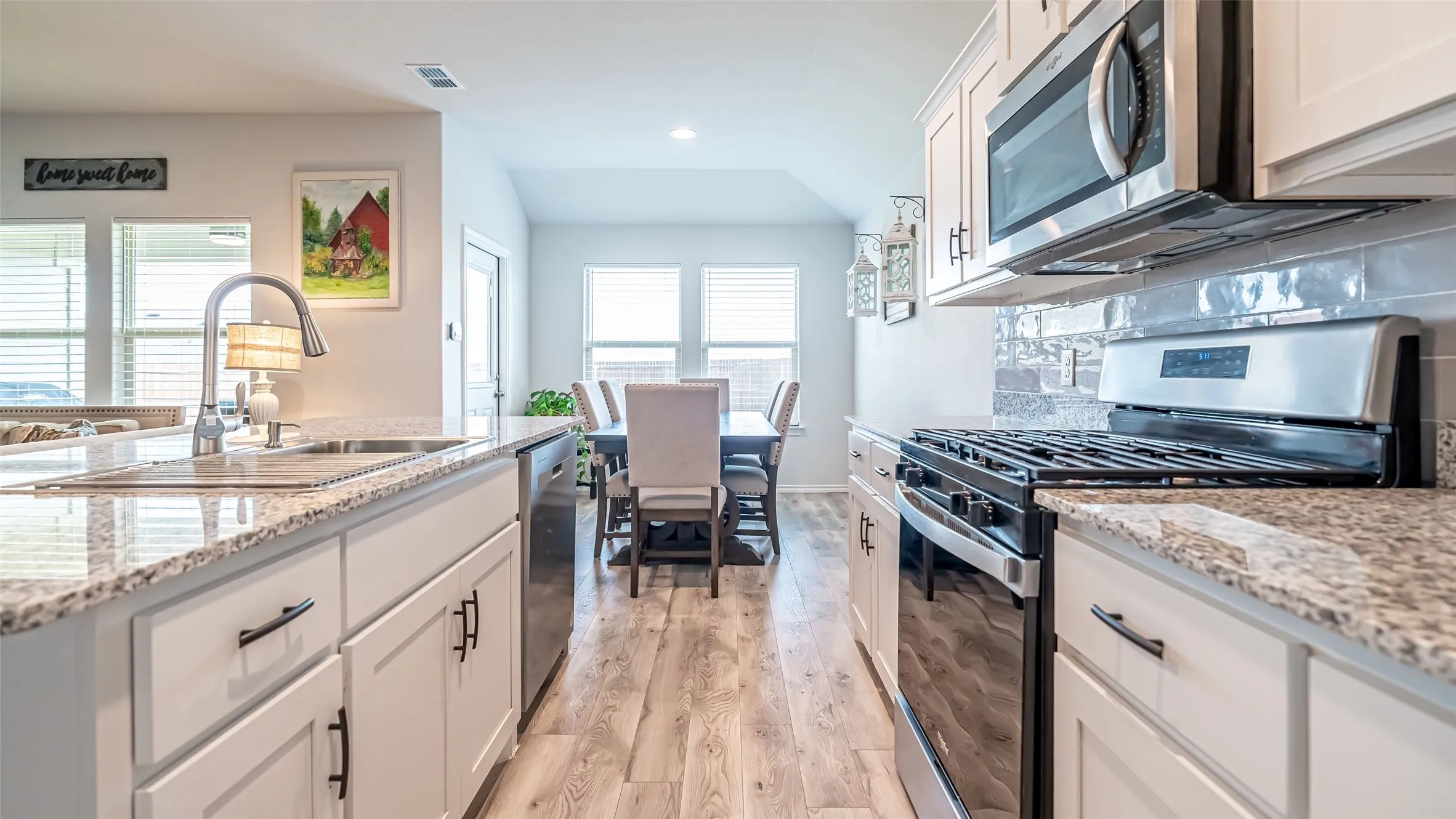 Granite counters and upgraded LVP flooring throughout living space and kitchen